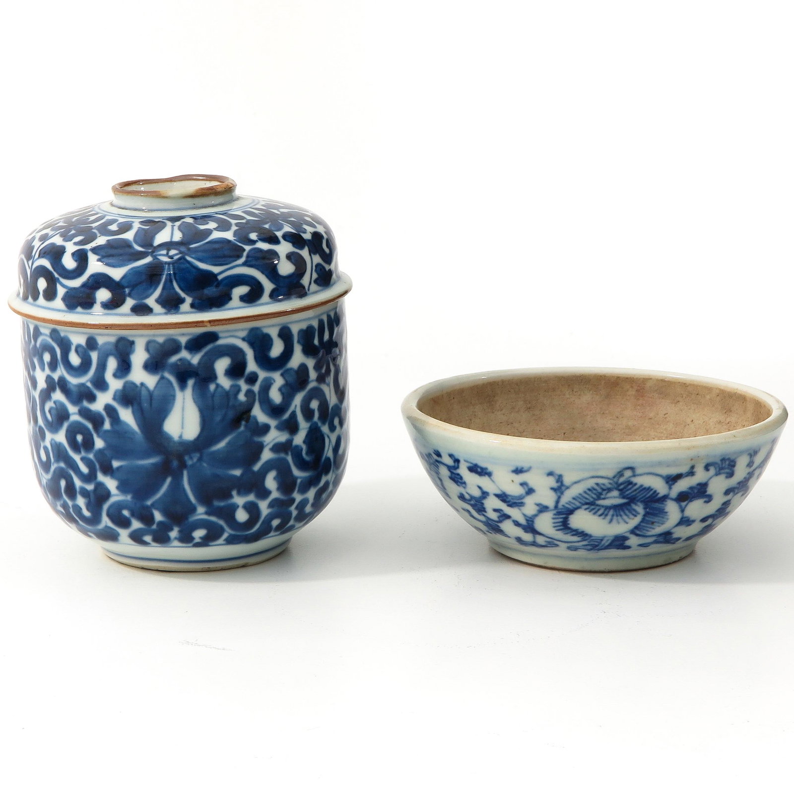 A Jar with Cover and Bowl: Blue and white floral decor, jar is 13 cm. tall.