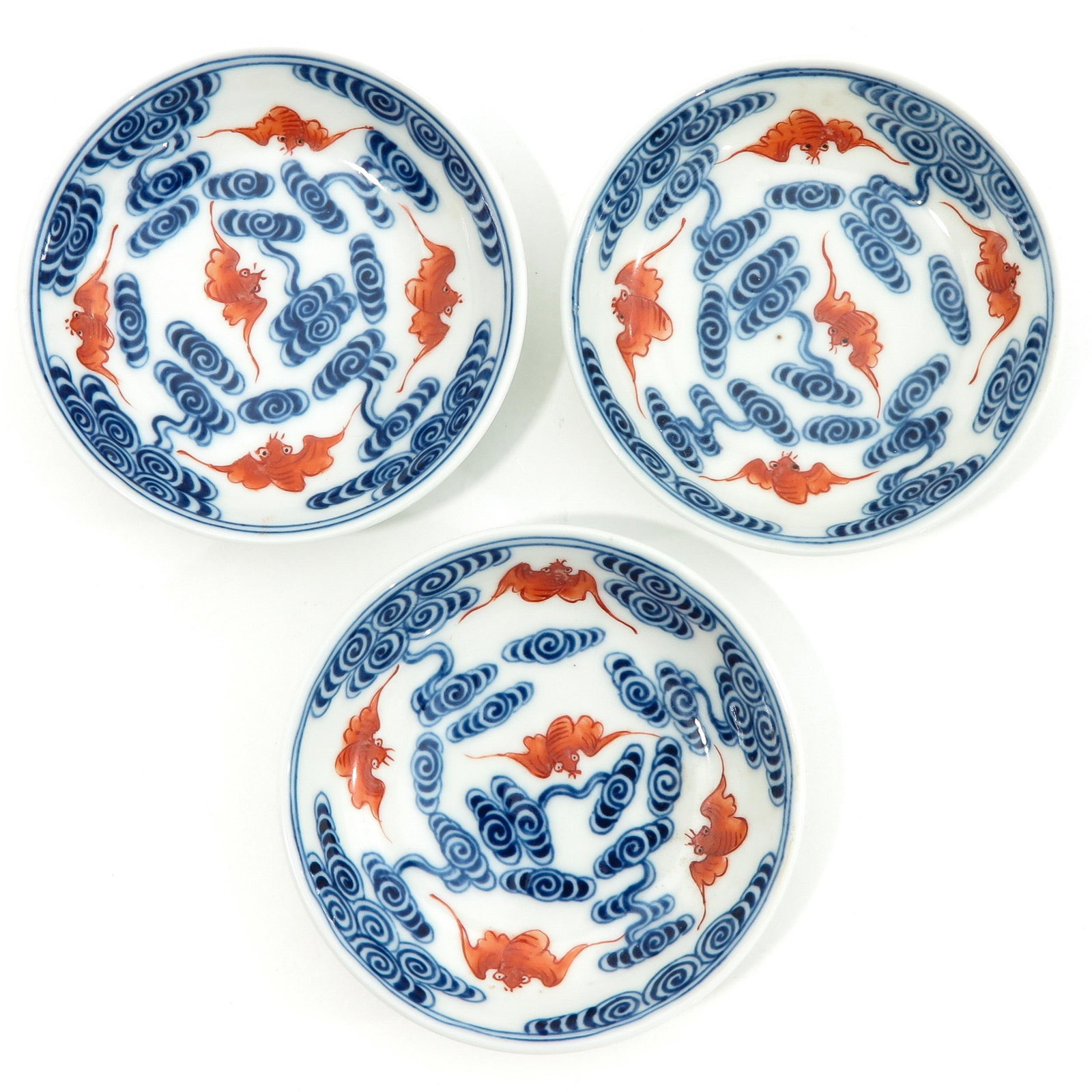 A Series of 3 Small Plates: Decorated with bats, Xuande mark, 10 cm. in diameter.