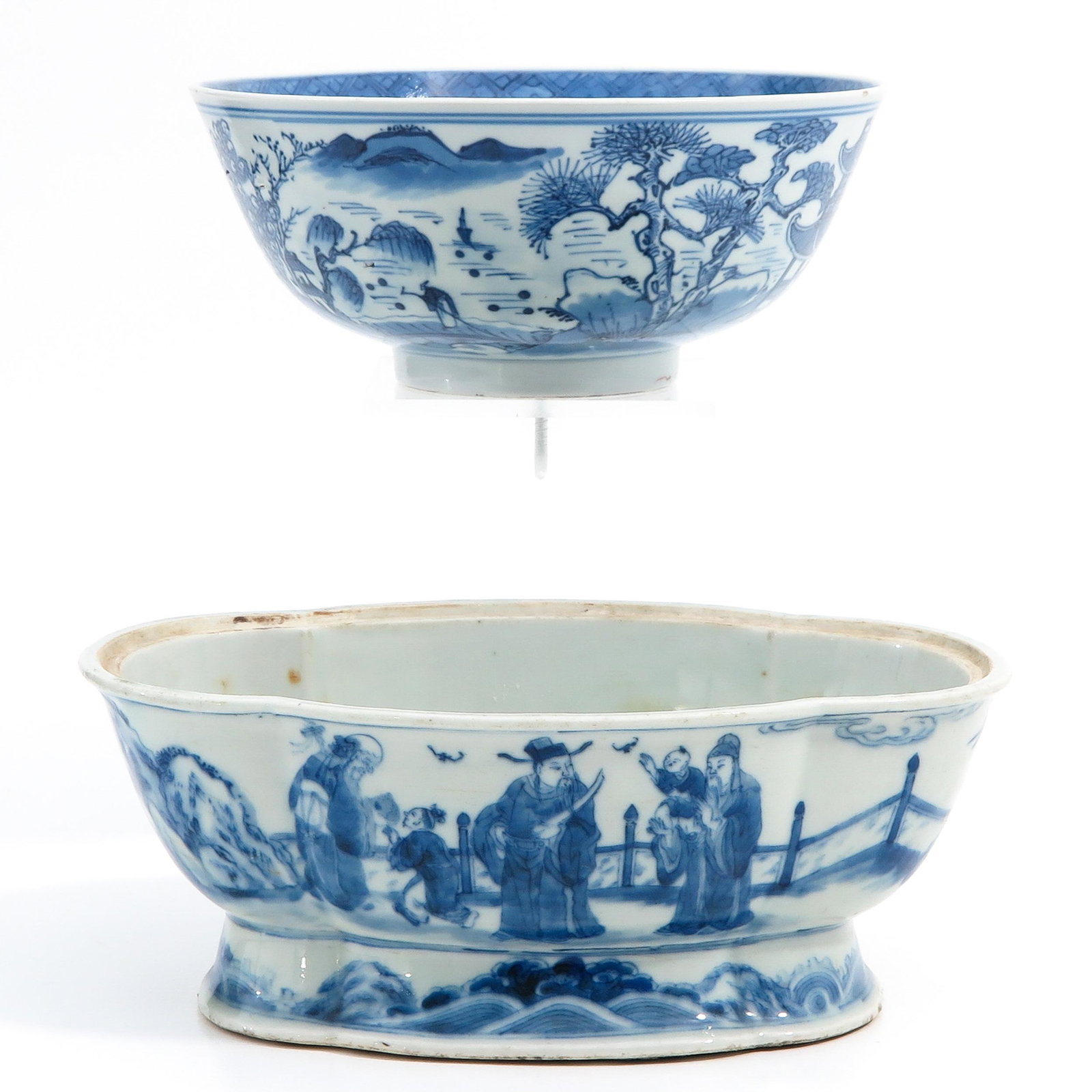 A Bowl and Serving Dish: Blue and white decors, bowl with Kangxi mark 21 cm. in diameter,dish is 25 cm. long, chip.