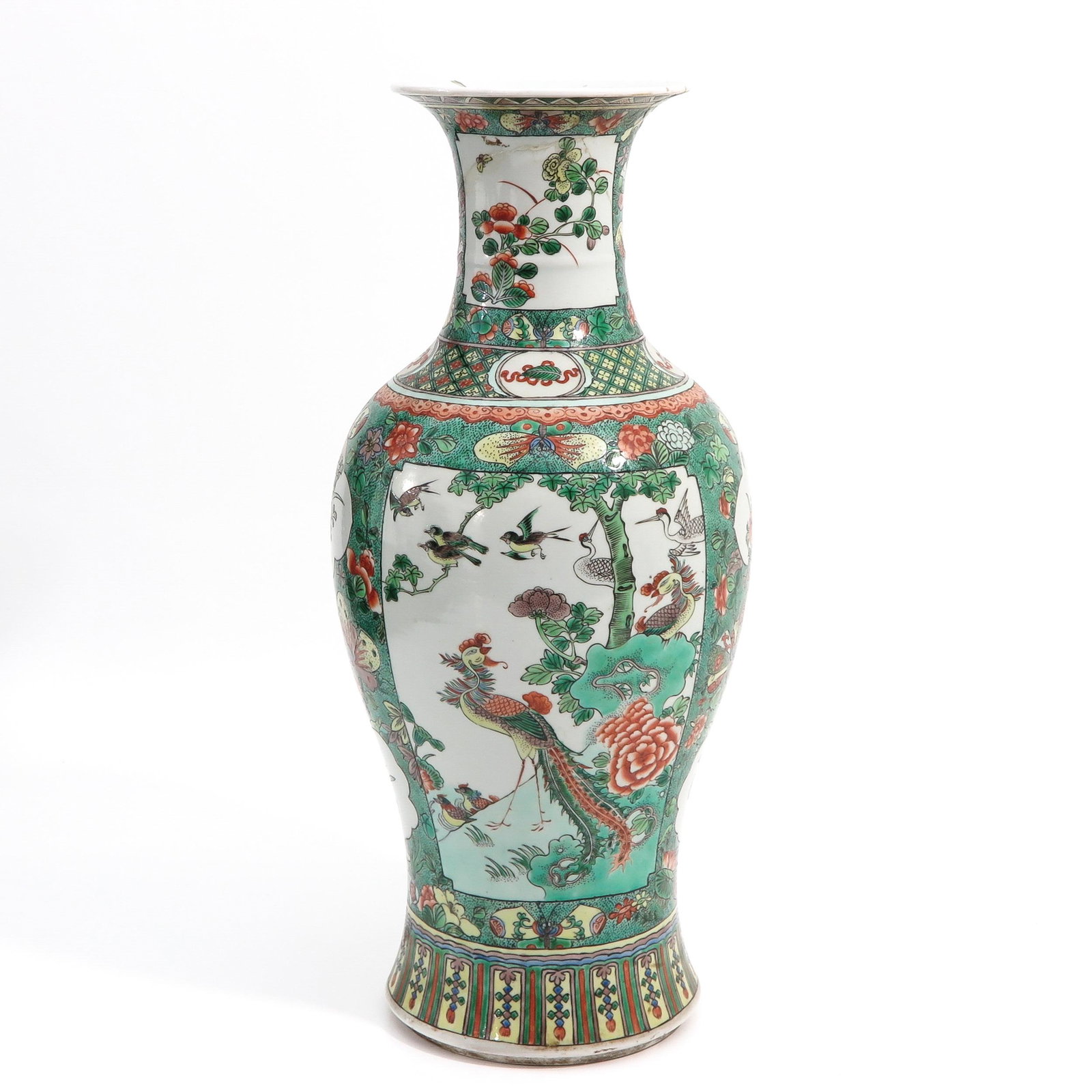 A Famille Verte Vase: Decorated with birds of paradise and flowers, 4 cm. tall, restored.