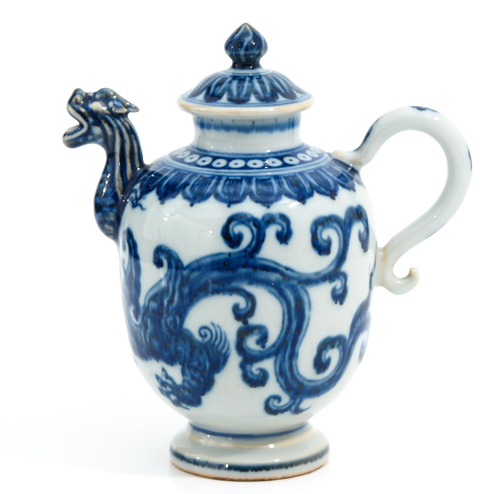A Blue and White Teapot: Dragon decor, Xuande mark, 20 cm. tall.