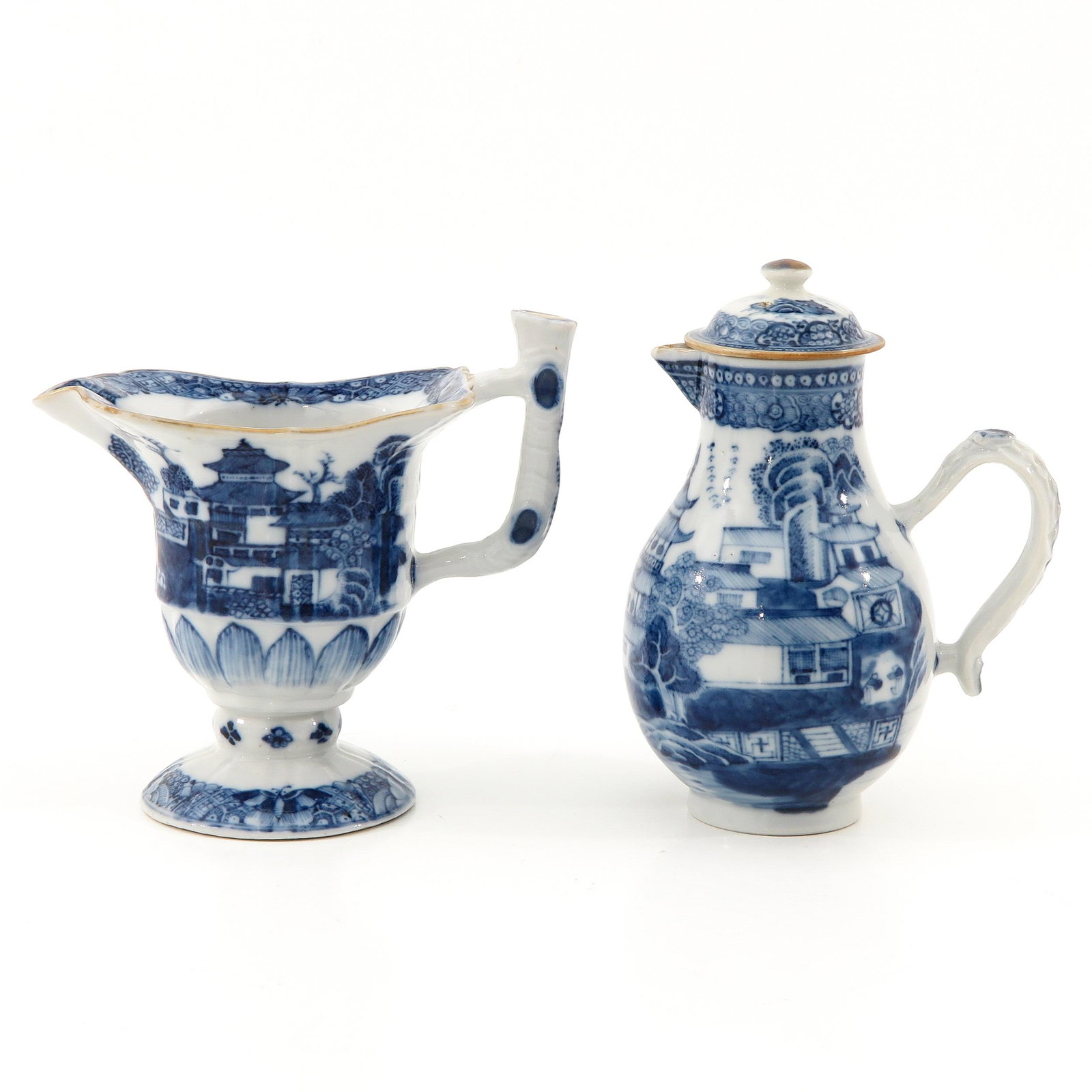 A Gravy Boat and Creamer: Blue and white landscape decors, circa 1800, 14 cm. tall.