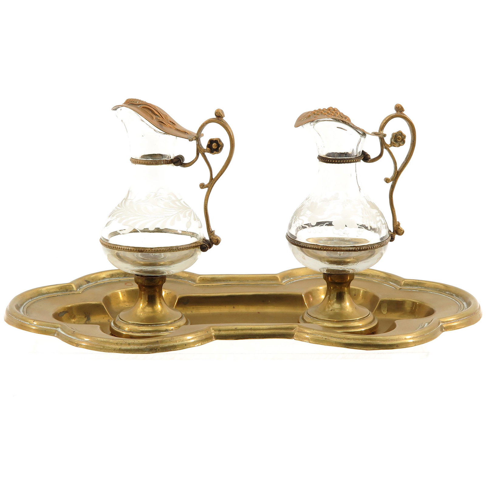 An Ampoule Set: Cut crystal decanters, height 14 cm.