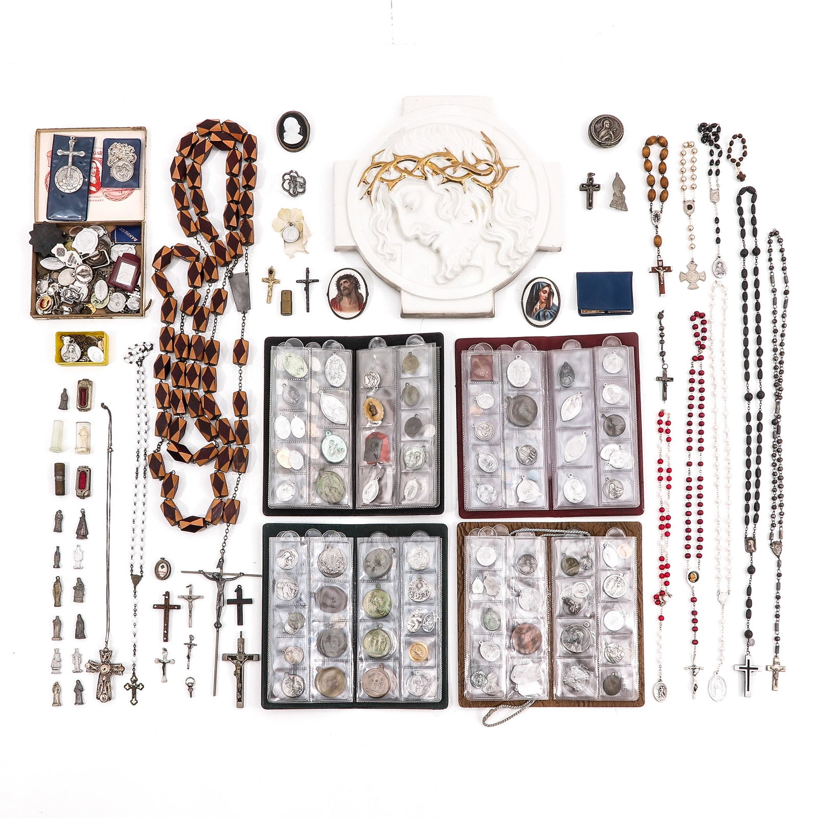 A Collection of Religious Items: Consisting of rosaries, many religious medallions and porcelain plaque with Christ, 26 x 26 cm.