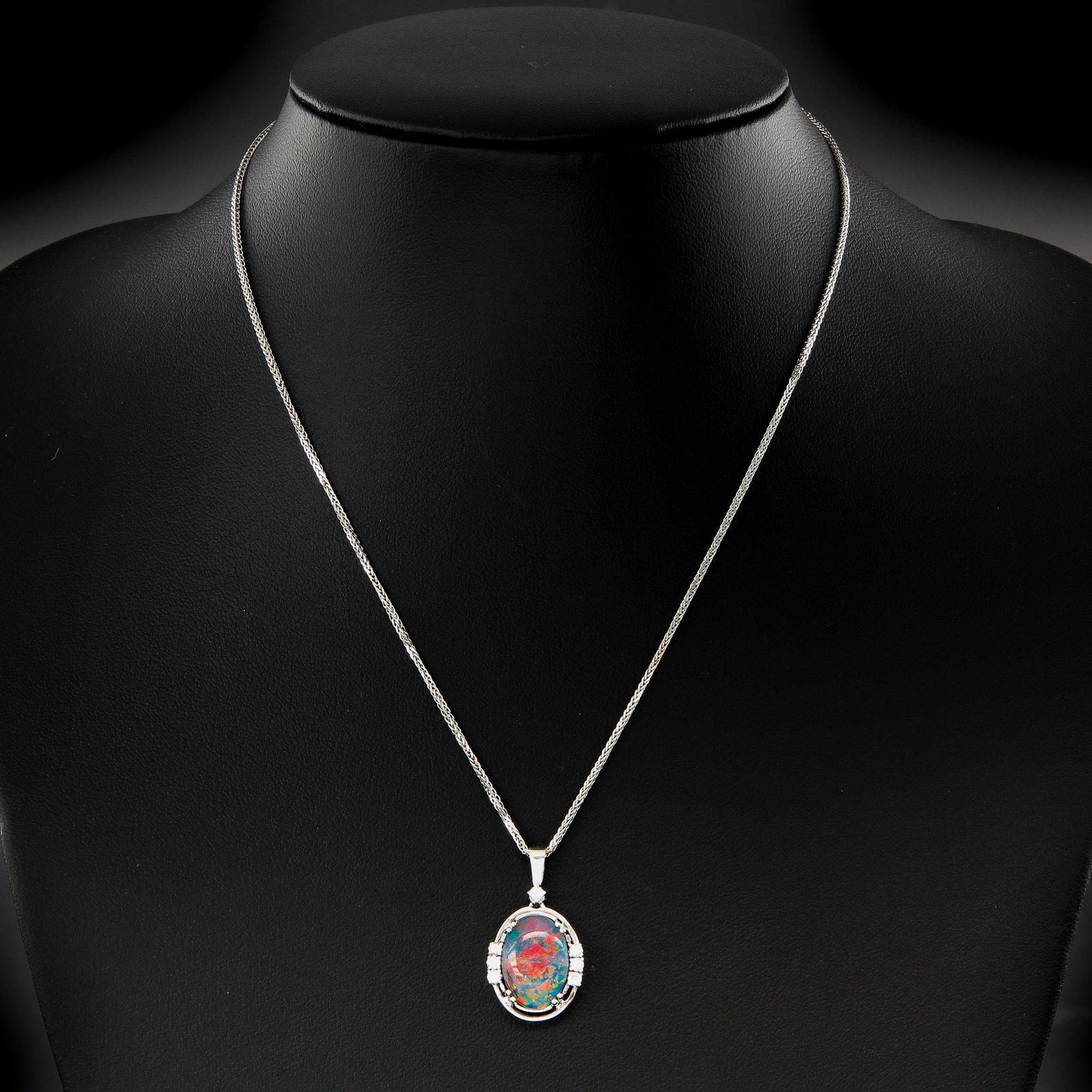 A 14KG Necklace and Opal and Diamond Pendant: 14KG pendant and necklace with opal and diamonds, dimensions opal 14 x 9 mm.
