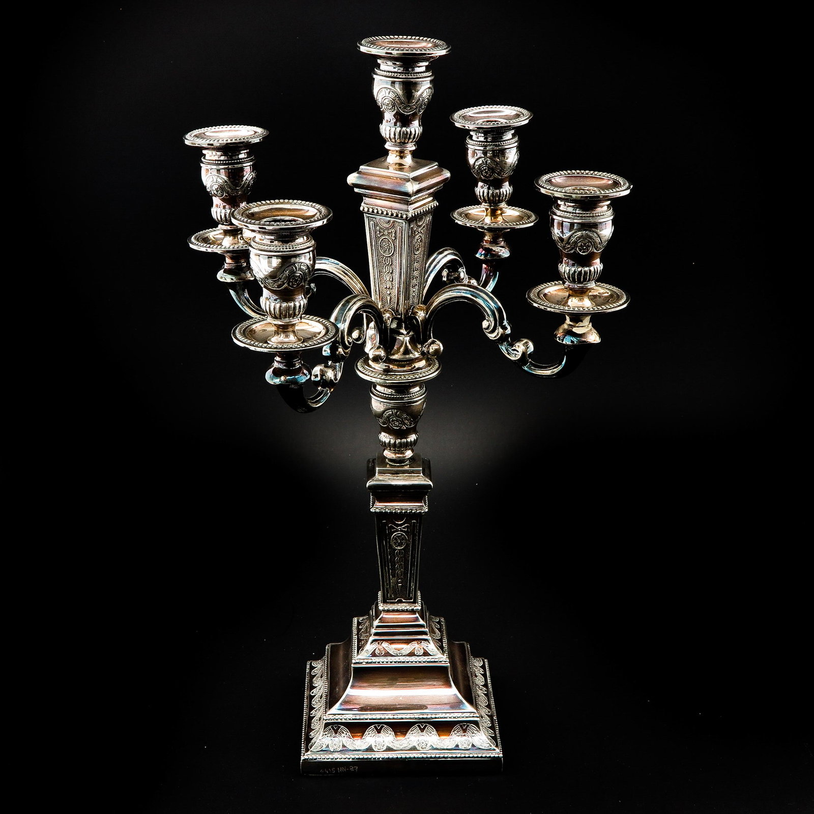 A Silver Candleabra: 5 arms, silver, second degree, height 42 cm.