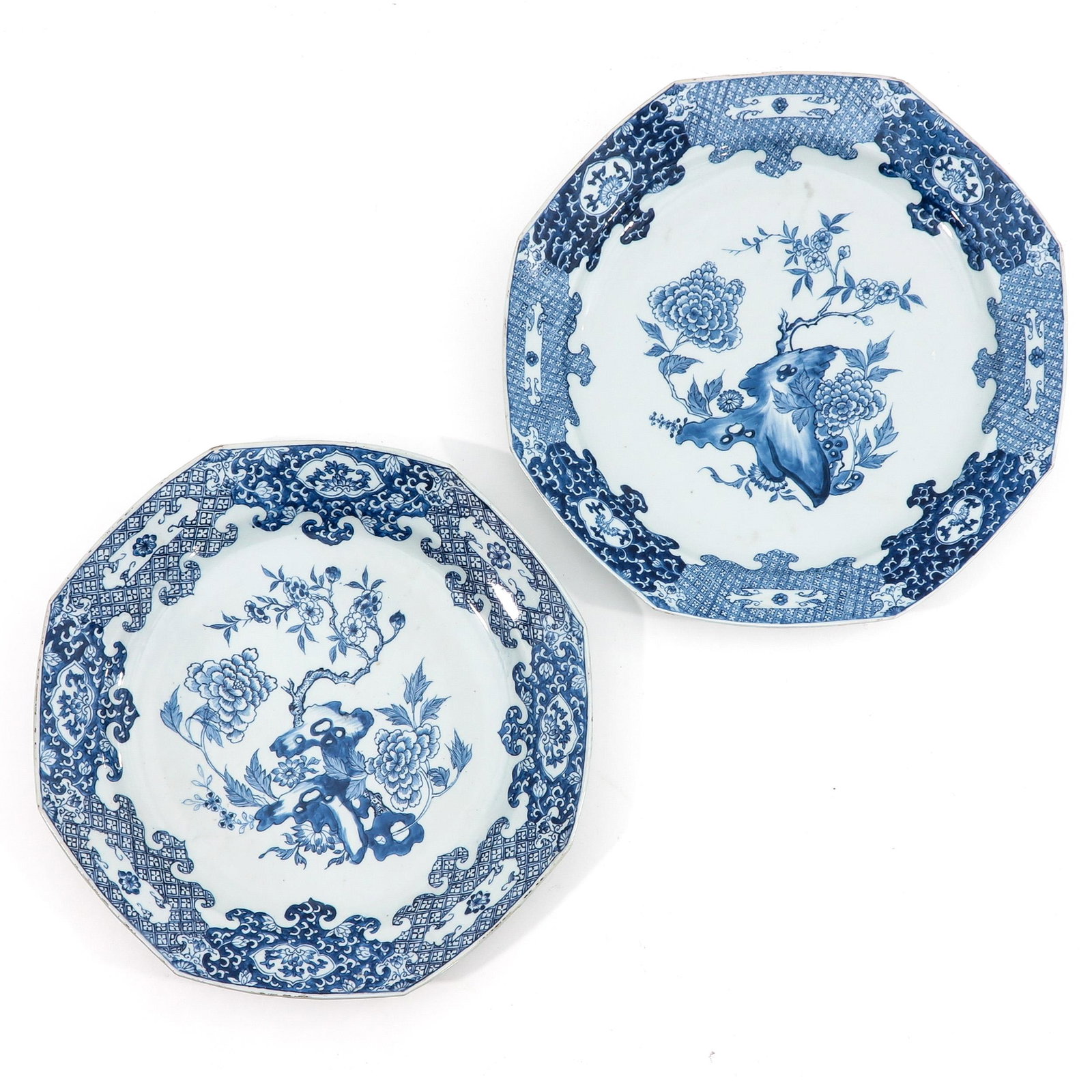 A Pair of Blue and White Chargers: Depicting scene in garden with flowers, 40 cm. in diameter.