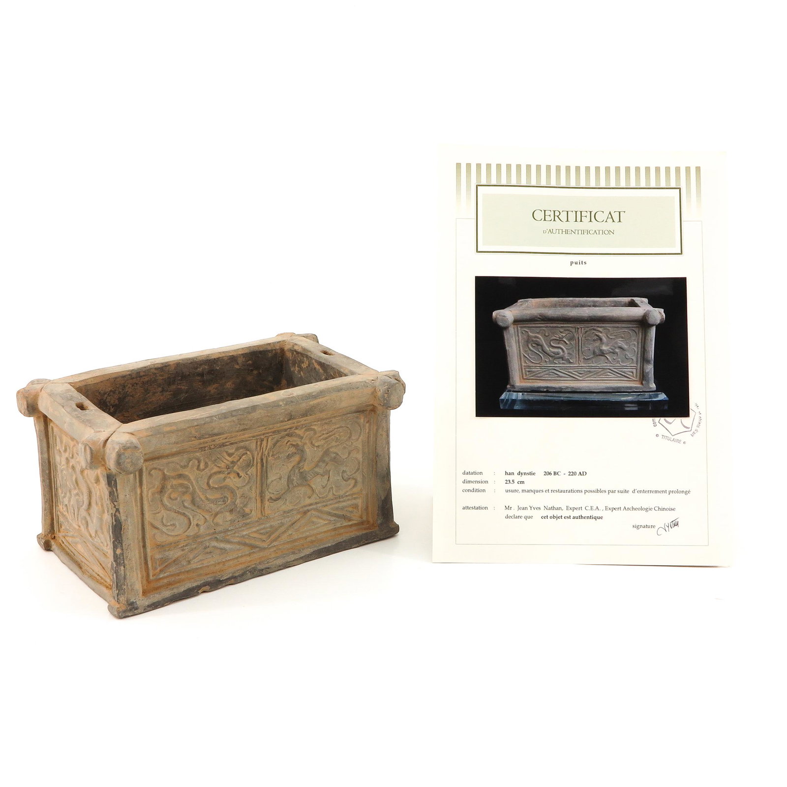 A Chinese Pottery Water Well: Han Dynasty, 23 cm. tall, sold with certificate of Authenticity of Age signed by expert Mr. Jean Yves Nathan, expert in Chinese Archeology.