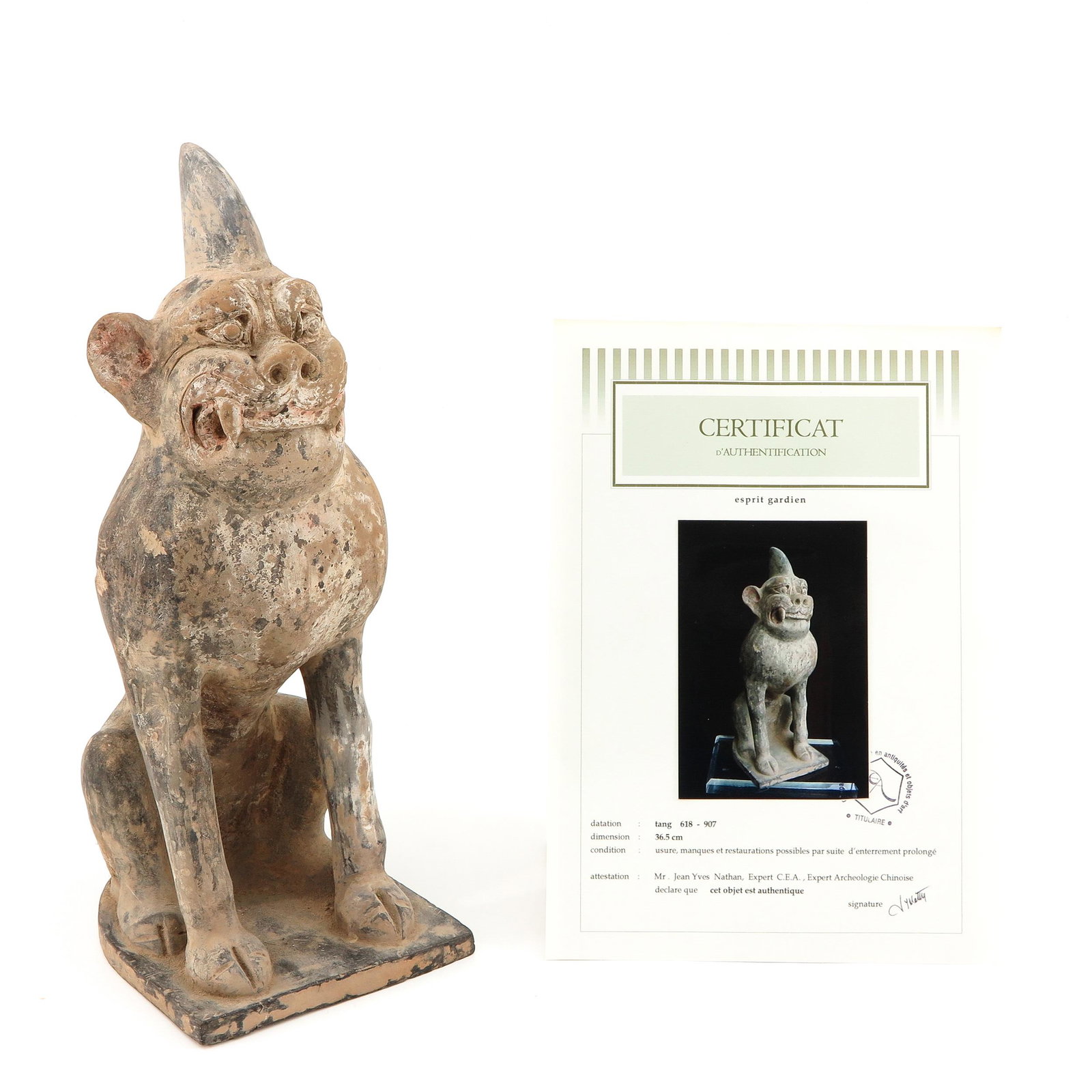 A Chinese Pottery Tomb Sculpture: Tang Dynasty, depicting guardian spirit, 36 cm. tall, sold with certificate of Authenticity of Age signed by expert Mr. Jean Yves Nathan, expert in Chinese Archeology.