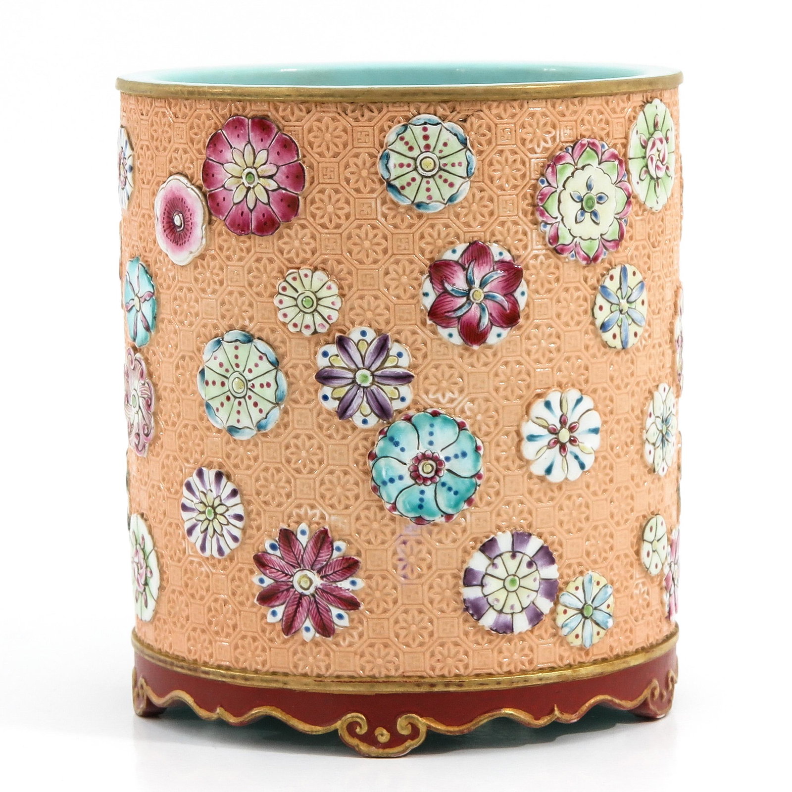 A Famille Rose Brush Pot: Peach ground decorated with flowers, Qianlong mark, 12 cm. in diameter x 13 cm. tall.