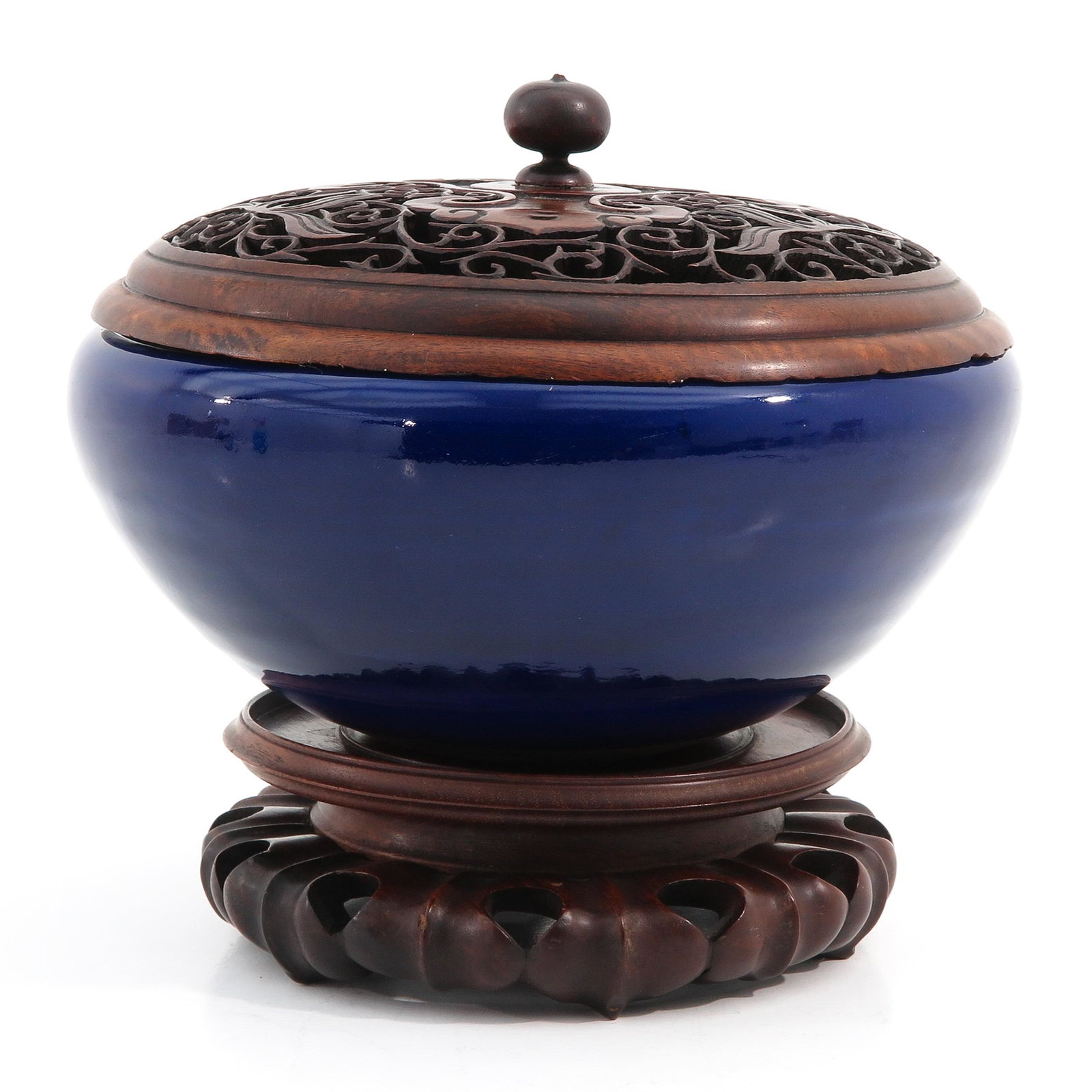 A Dark Blue Glaze Censer with Cover: Carved wood top and base, 25 cm. tall including base, 26 cm. in diameter.