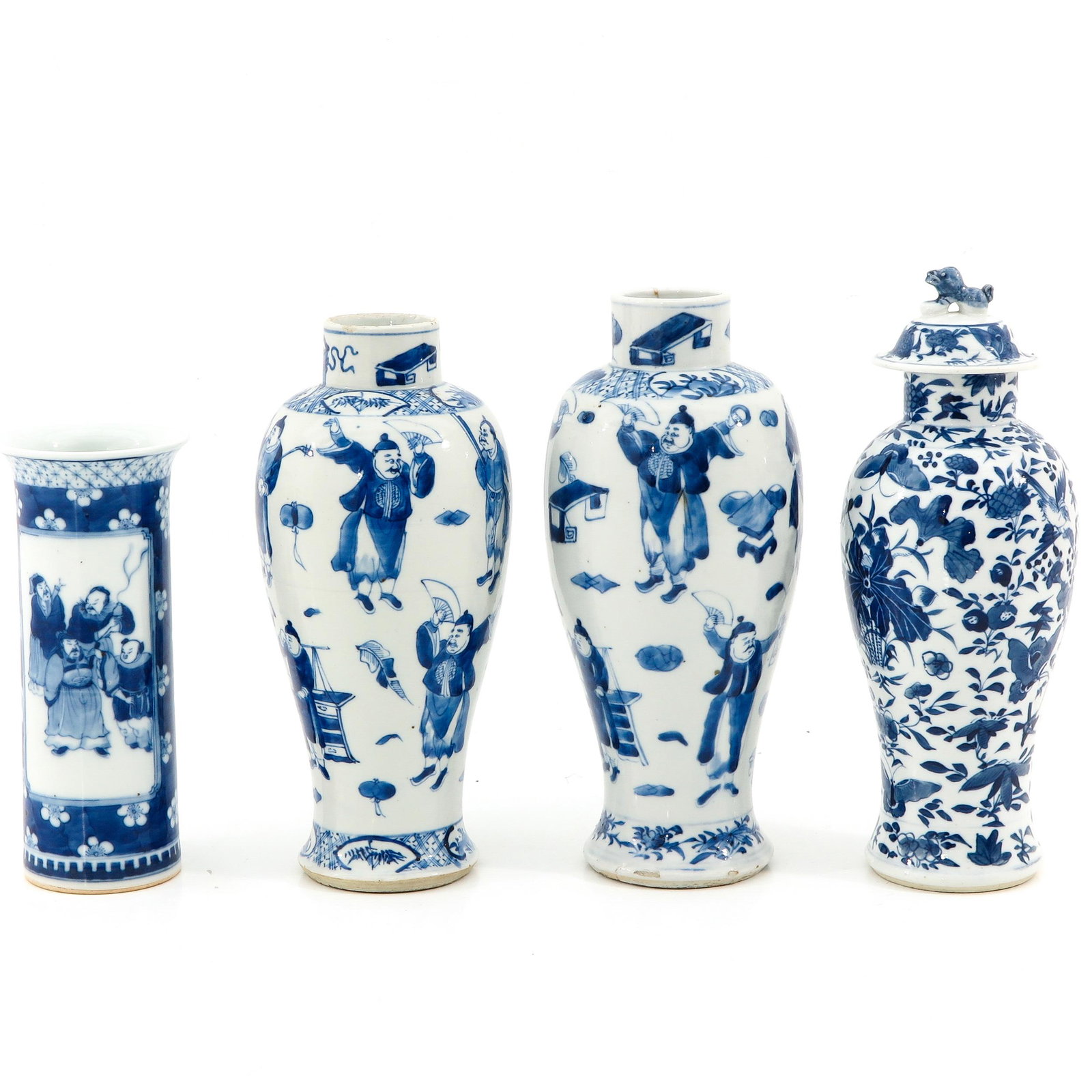 A Lot of 4 Blue and White Vases: In a variety of decors and sizes, vase with cover is 32 cm. tall.