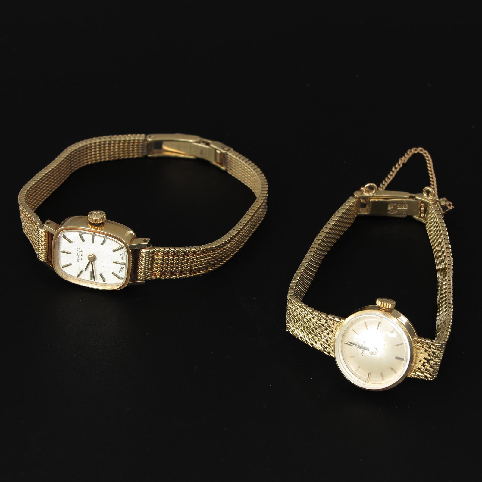 A Ladies Omega and Pontiac Watches: 14KG.
