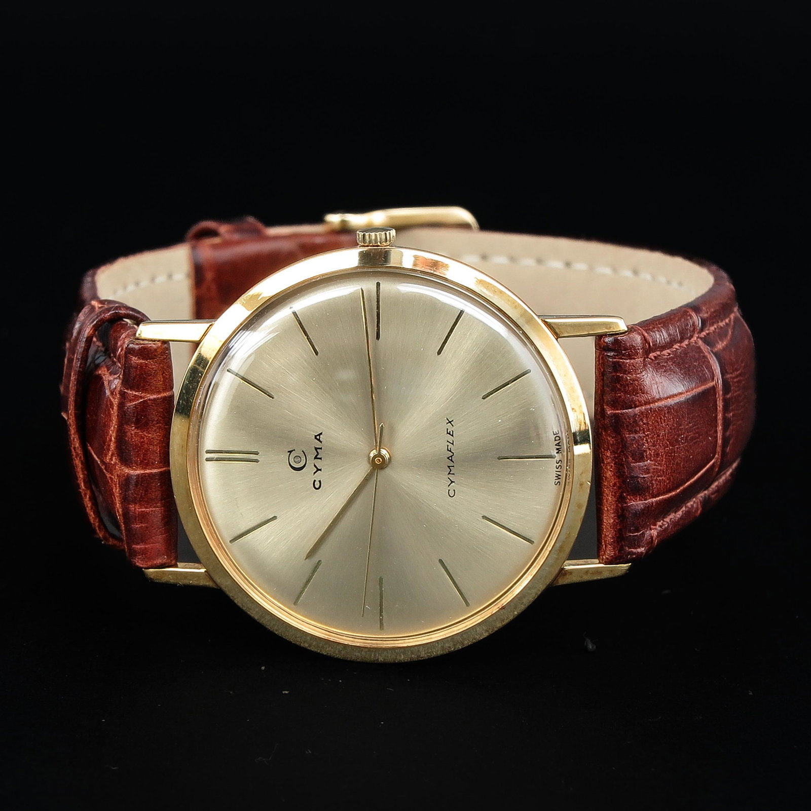 A Mens 14KG Cyma Watch: On leather band, case is 34 mm. in diameter.
