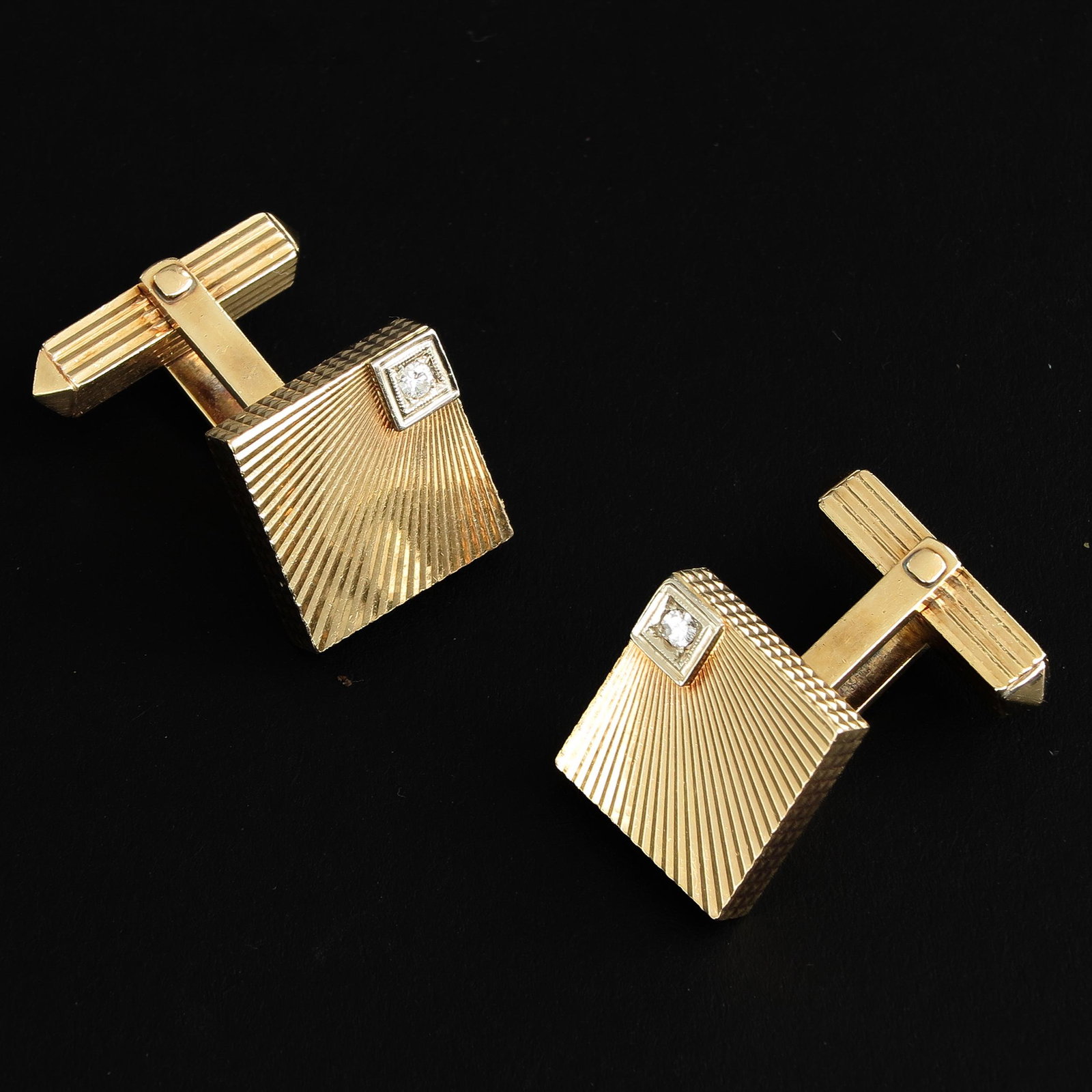 A Set of 14KG and Diamond Cuff Links: 14KG and diamonds.
