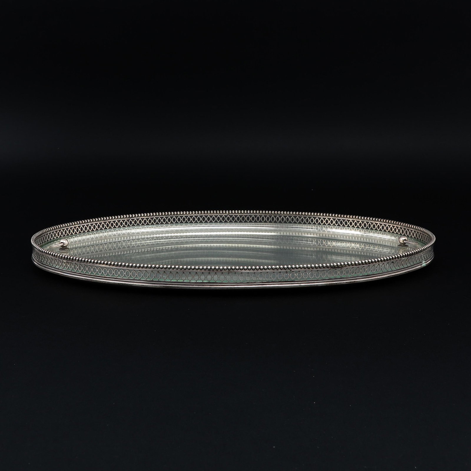 A Silver Serving Tray: 835/1000 silver, marked V.S., 36 cm. long.