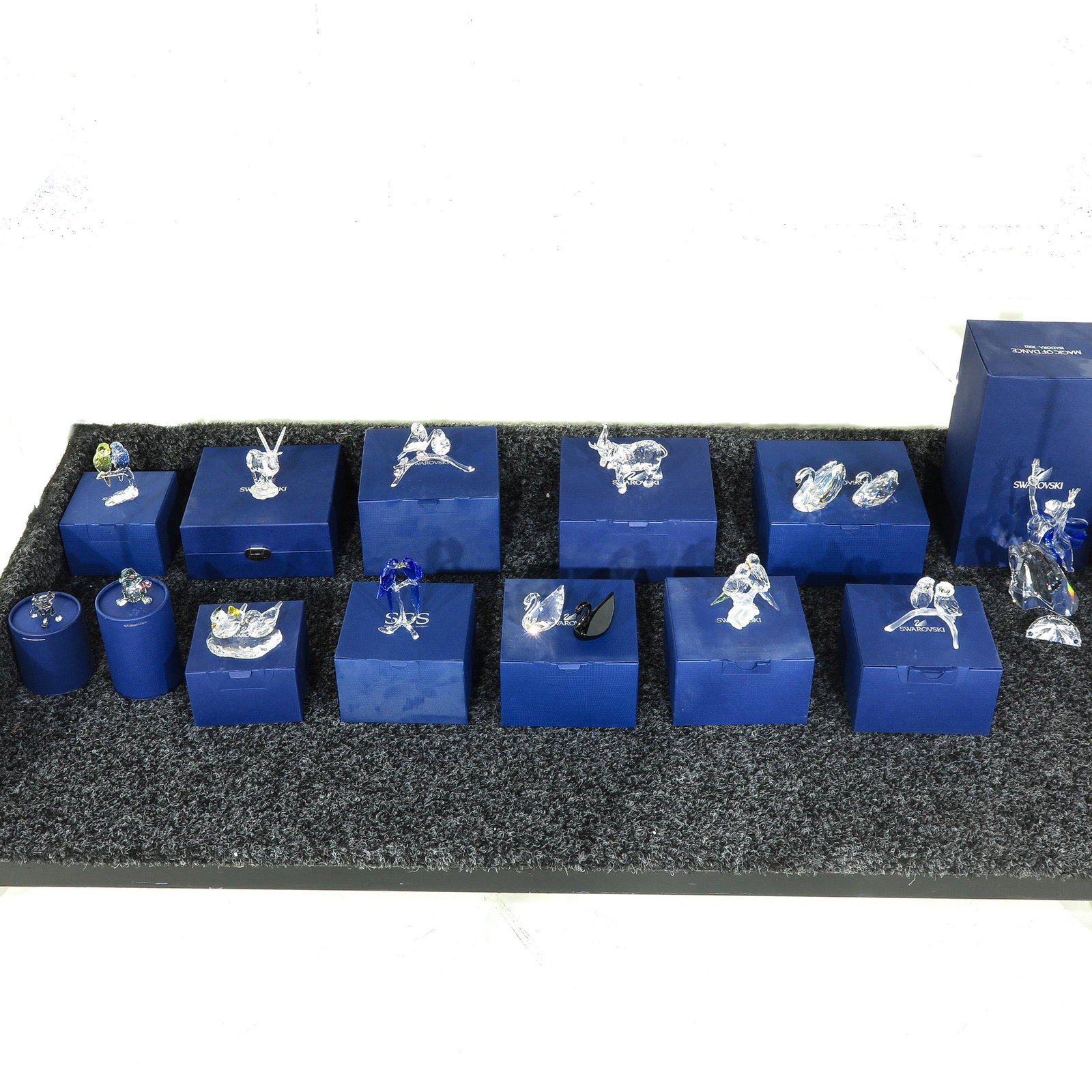 A Collection of Thirteen Swarovski Crystal Sculptures: Including Magic of Dance, with boxes, 20 cm. tall.