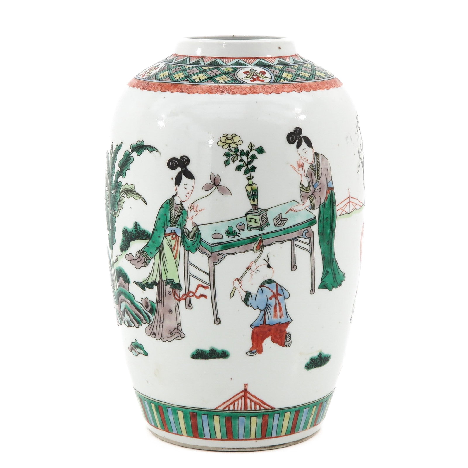 A Famille Verte Jar: Depicting Chinese figures gathering around a table in the garden, 28 cm. tall.