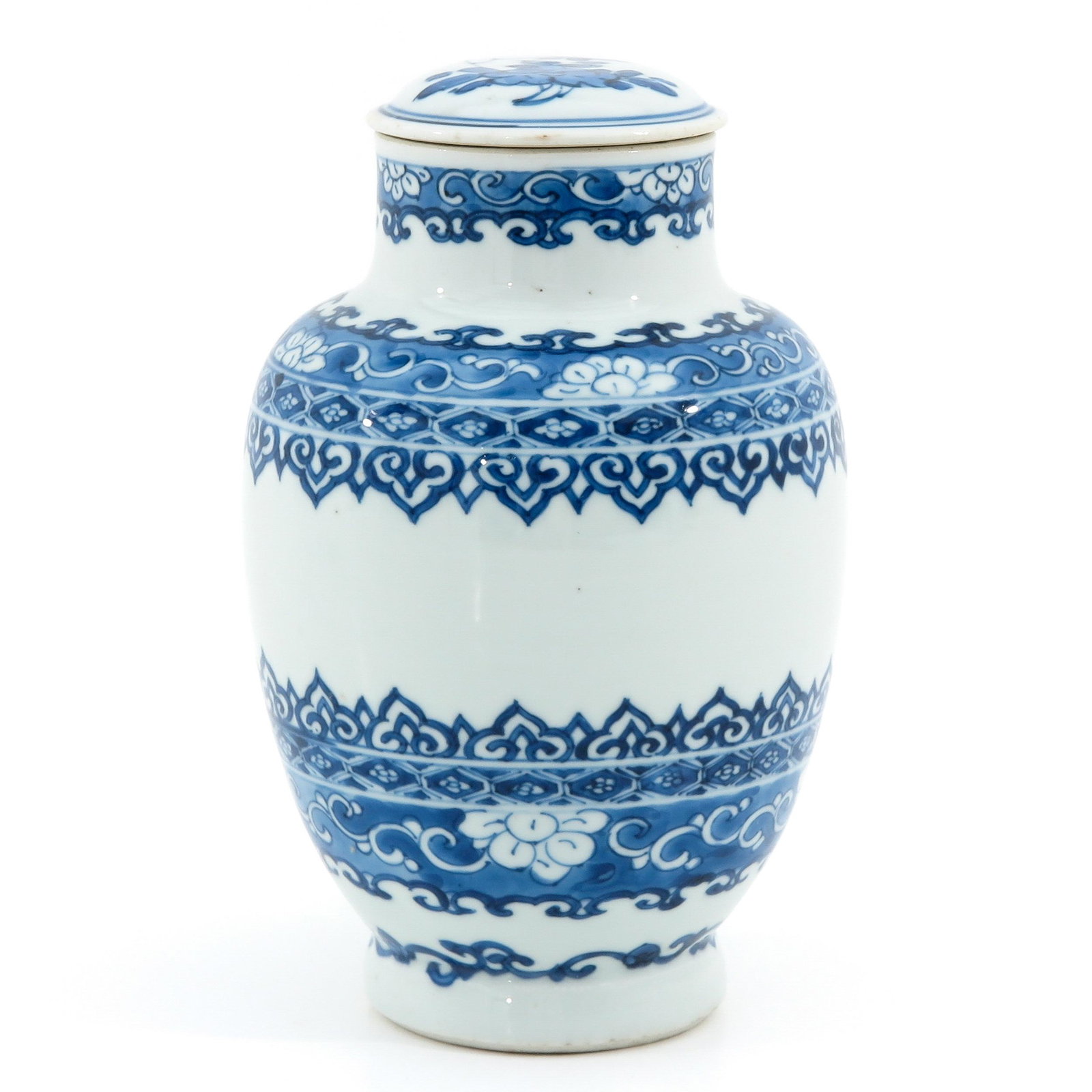 A Blue and White Jar and Cover: Floral decor, 19 cm. tall, chip on cover.