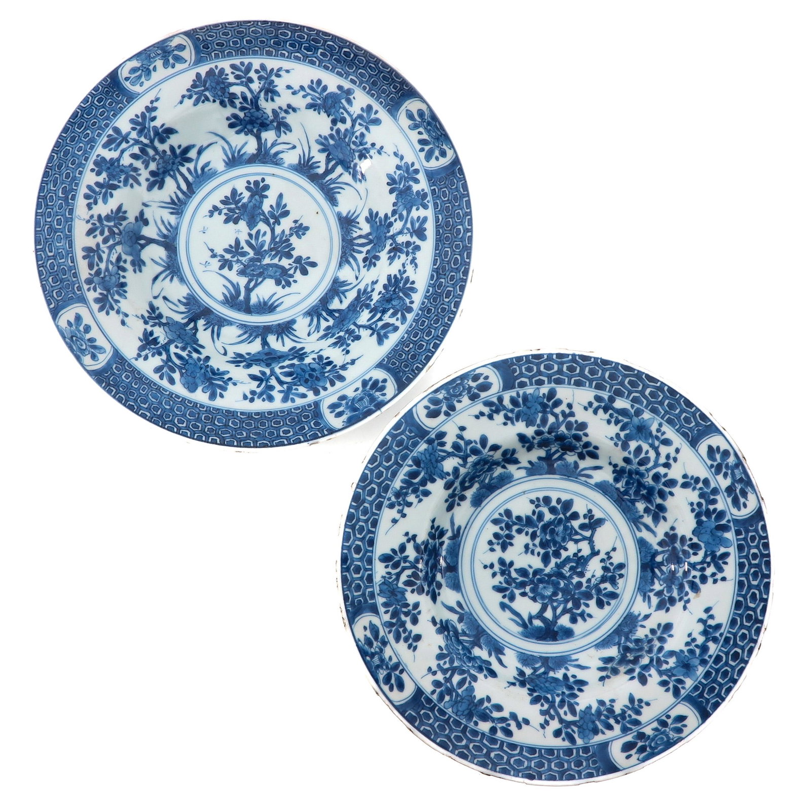 A Pair of Blue and White Plates: Floral decor, 27 cm. in diameter, chip.