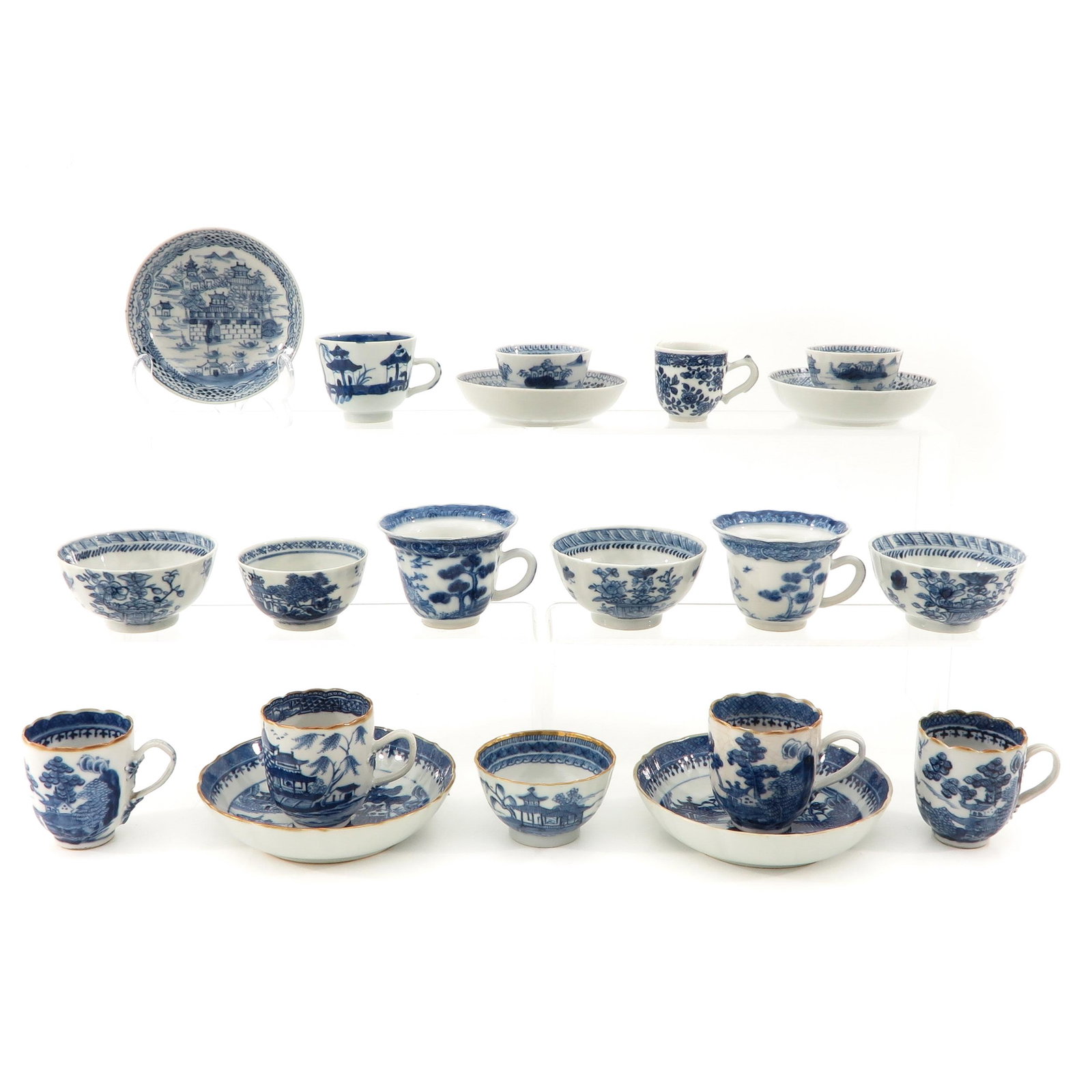 A Collection of Porcelain: Including 15 cups and 5 saucers in a variety of blue and white decors, largest saucer is 14 cm. in diameter, in diverse conditions.