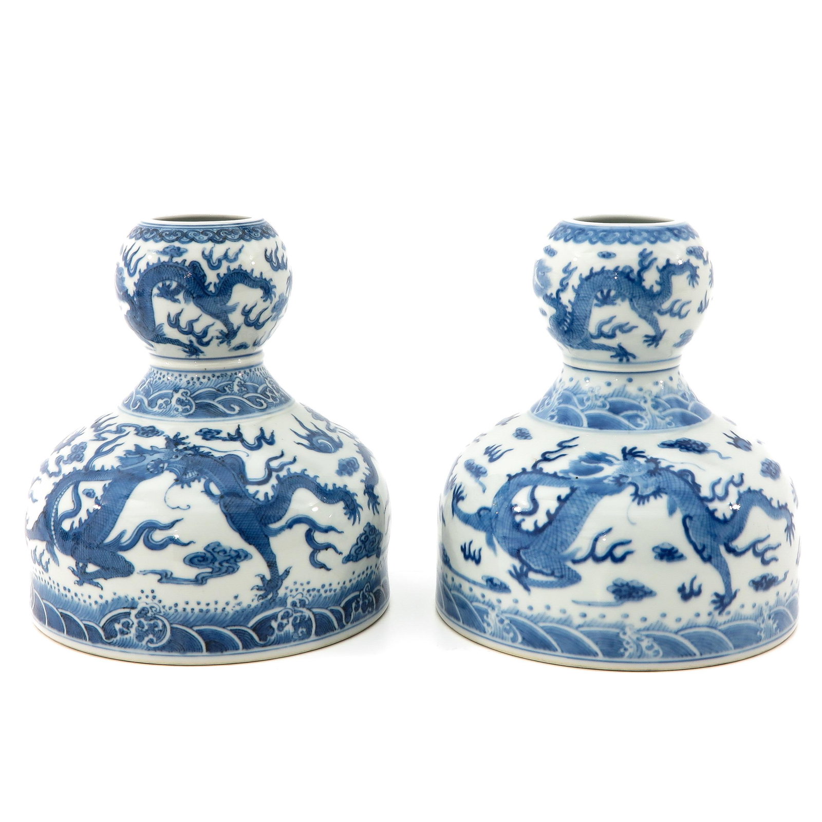 A Pair of Blue and White Vases: Decorated with 5 claw dragons and clouds, Daoguang mark, 19 cm. tall.
