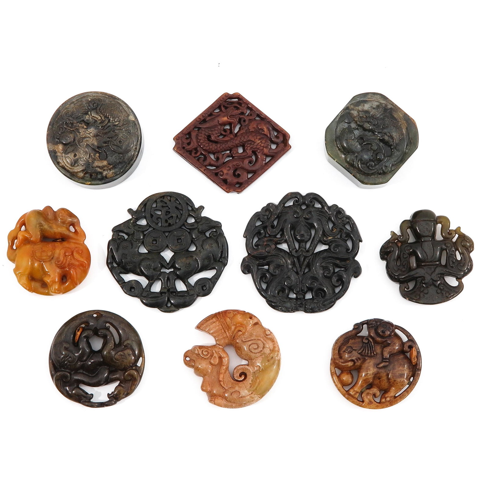 A Collection of 10 Carved Jade Sculptures: In diverse decors and sizes, largest sculpture is 7 cm. in diameter.