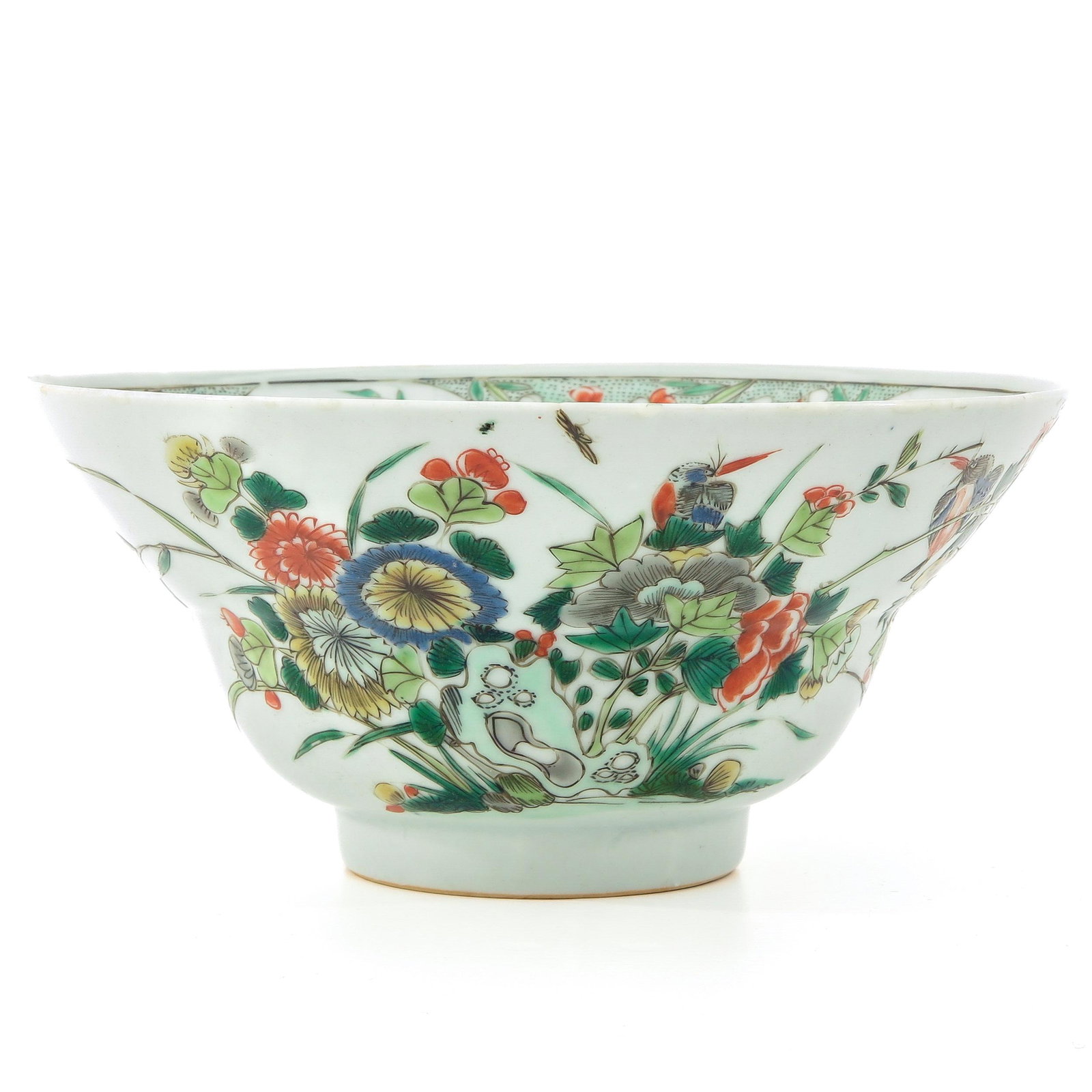 A Famille Verte Bowl: Floral decor with butterflies, 18 cm. in diameter, restorations on edge and hairline.