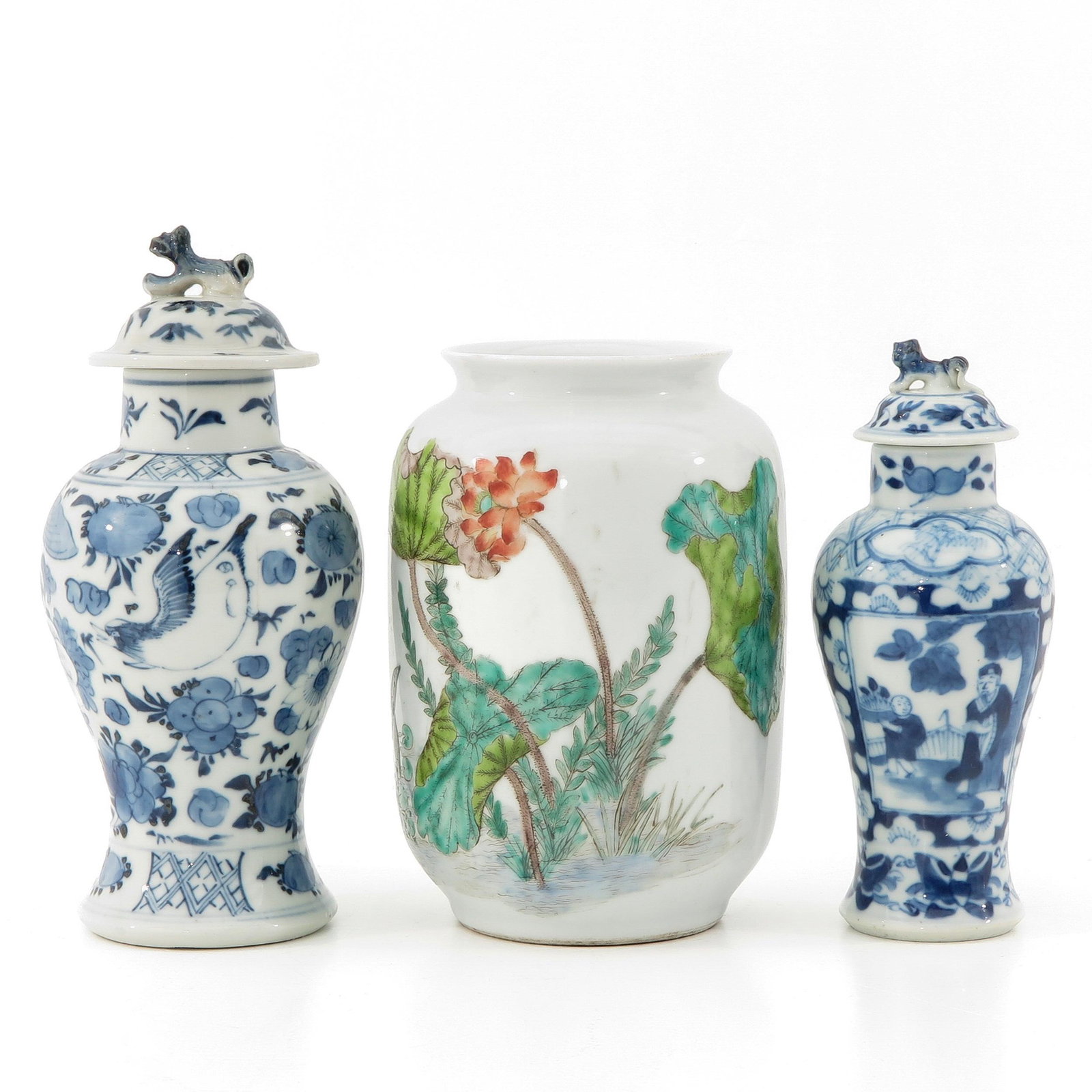 A Collection of Porcelain: Including 1 polychrome decor vase marked Qianlong 19 cm. tall and 2 blue and white garniture vases 16 cm. tall.