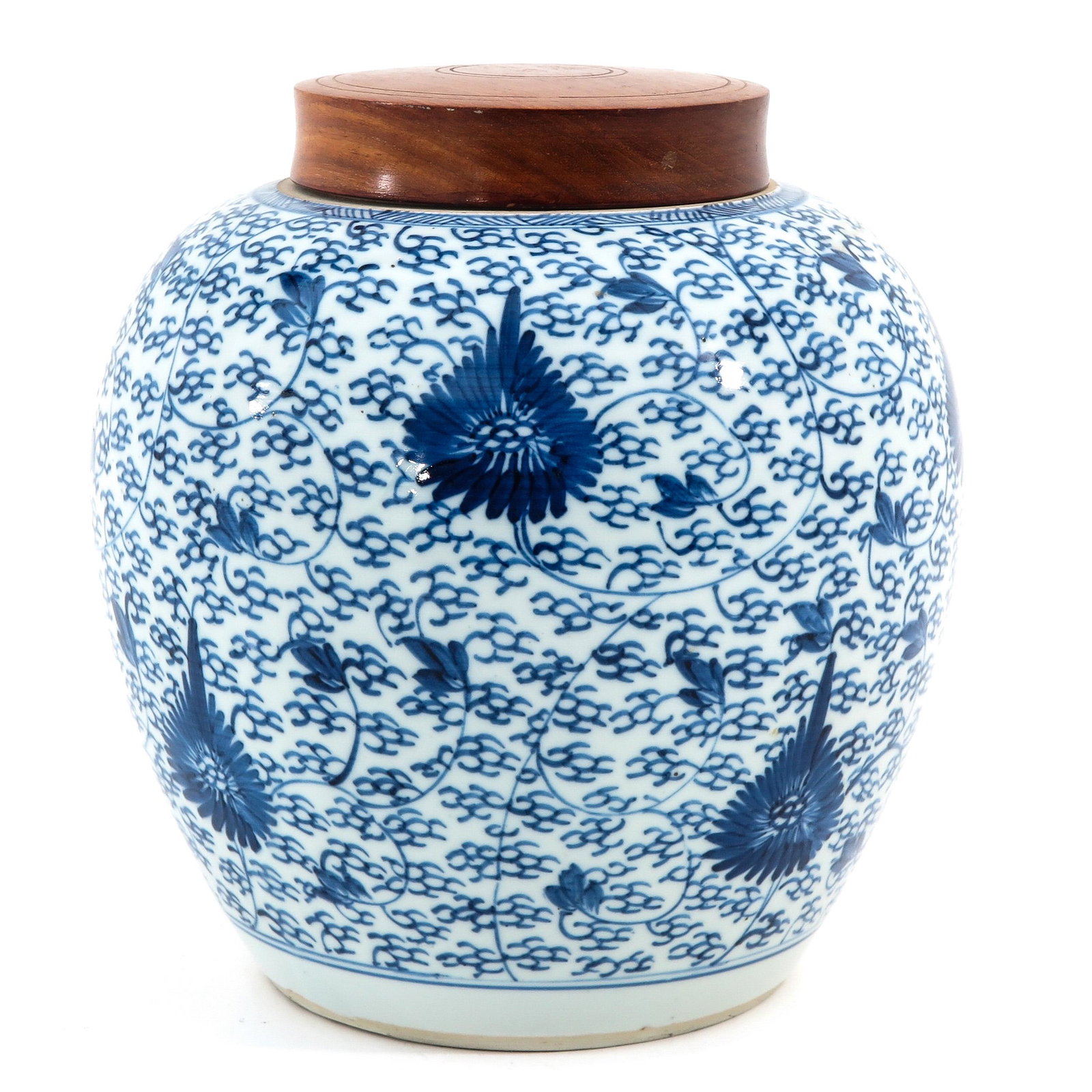 A Blue and White Jar with Cover: Floral decor, wood cover, 18th Century, 24 cm. tall.
