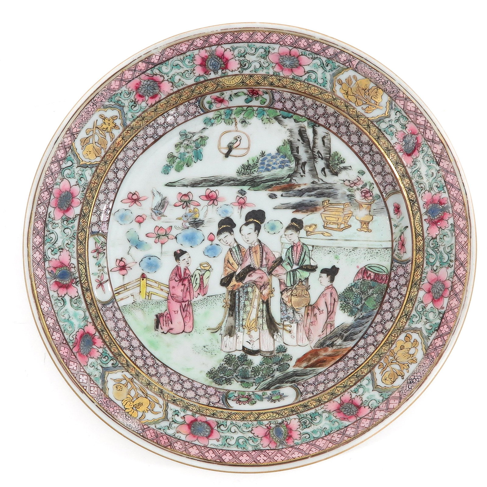 A Famille Rose Plate: Depicting scene in garden with gathering of Chinese ladies in Famille Rose and gilt enamels, 18th Century, 22 cm. in diameter.