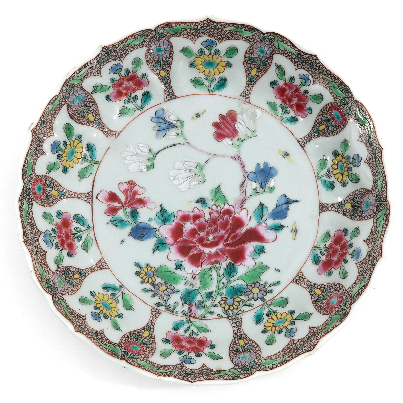 A Famille Rose Plate: Floral decor in Famille Rose enamels, 18th Century, 21 cm. in diameter.