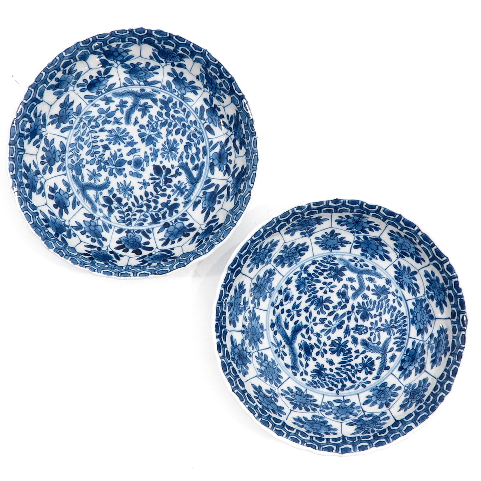 A Pair of Blue and White Plates: Floral decor, marked with double ring and censer, 16 cm. in diameter.