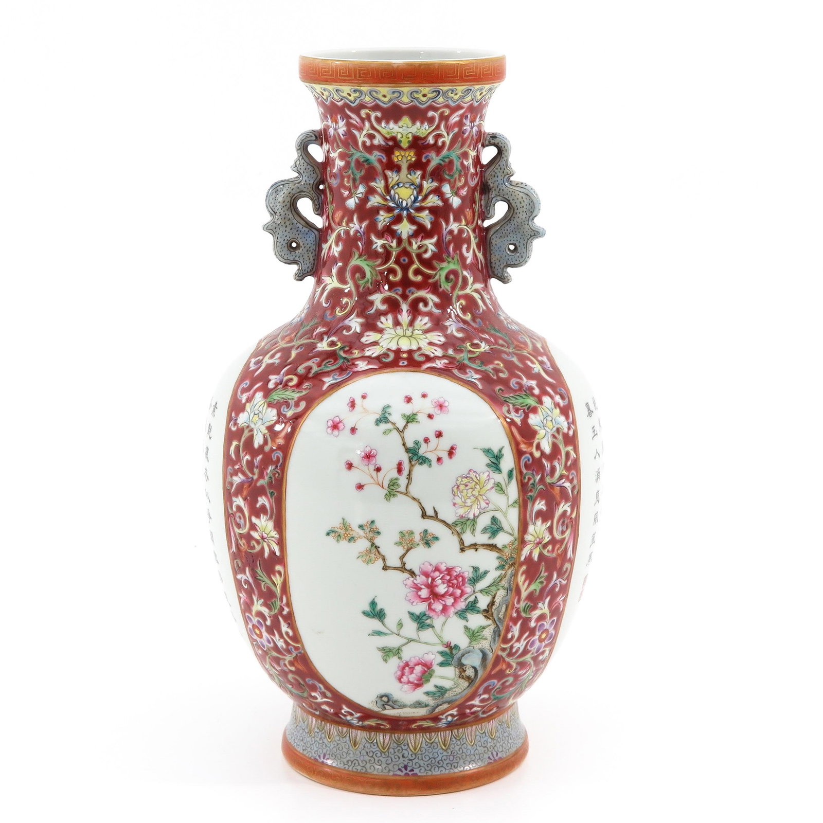 A Famille Rose Vase: Ruby ground, decorated with scene of flowers and Chinese text, Qianlong mark, 29 cm. tall.