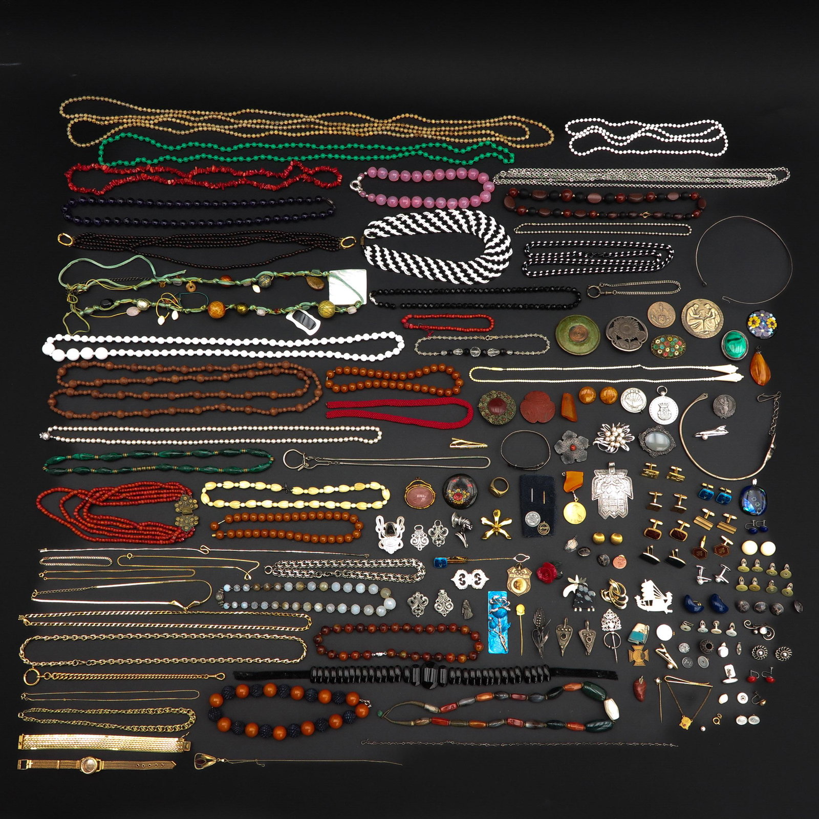 A Large Collection of Jewelry: Including necklaces with red coral, carnelian, agate, and pearls.