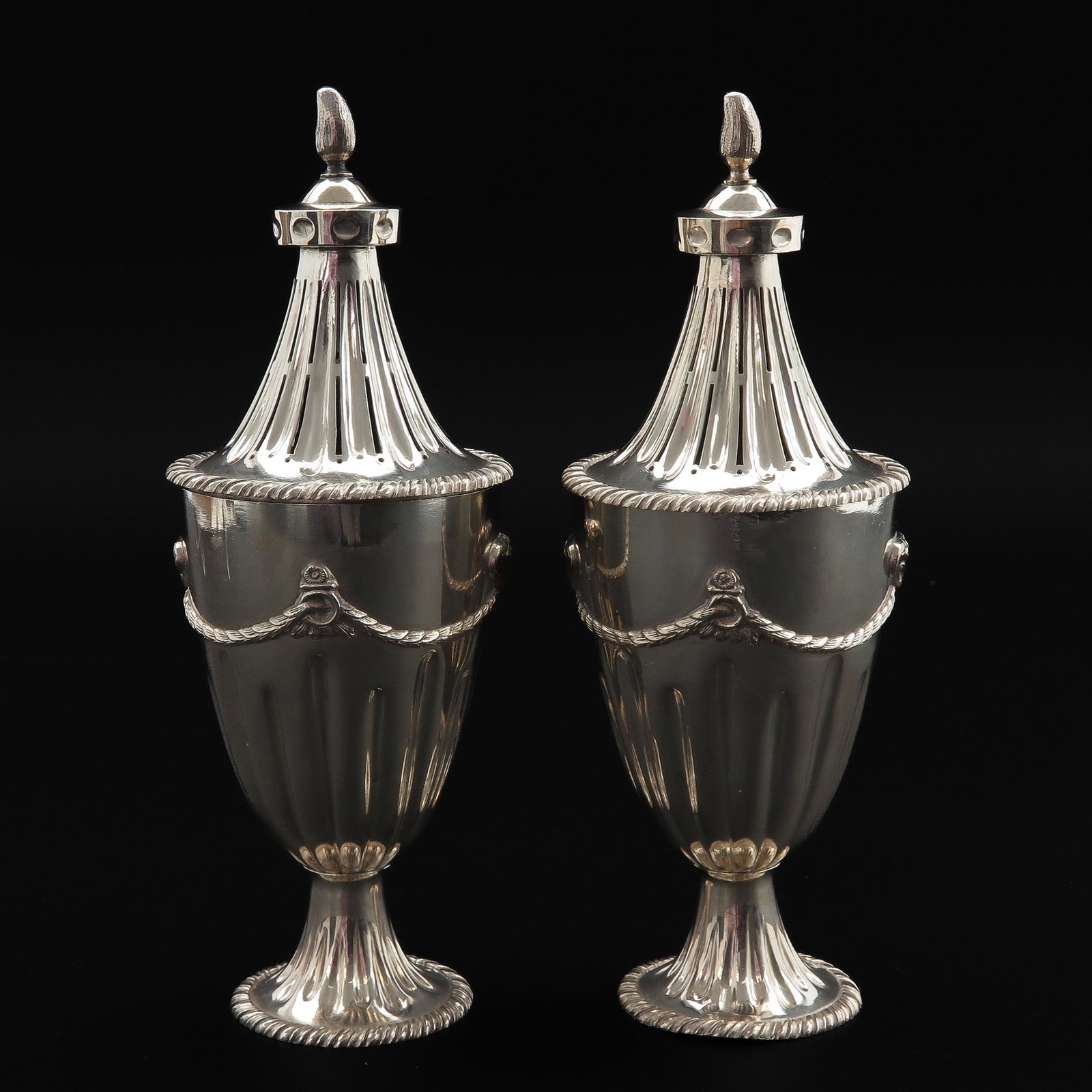 A Pair of Silver Potpourri Vases: 26 cm. tall.