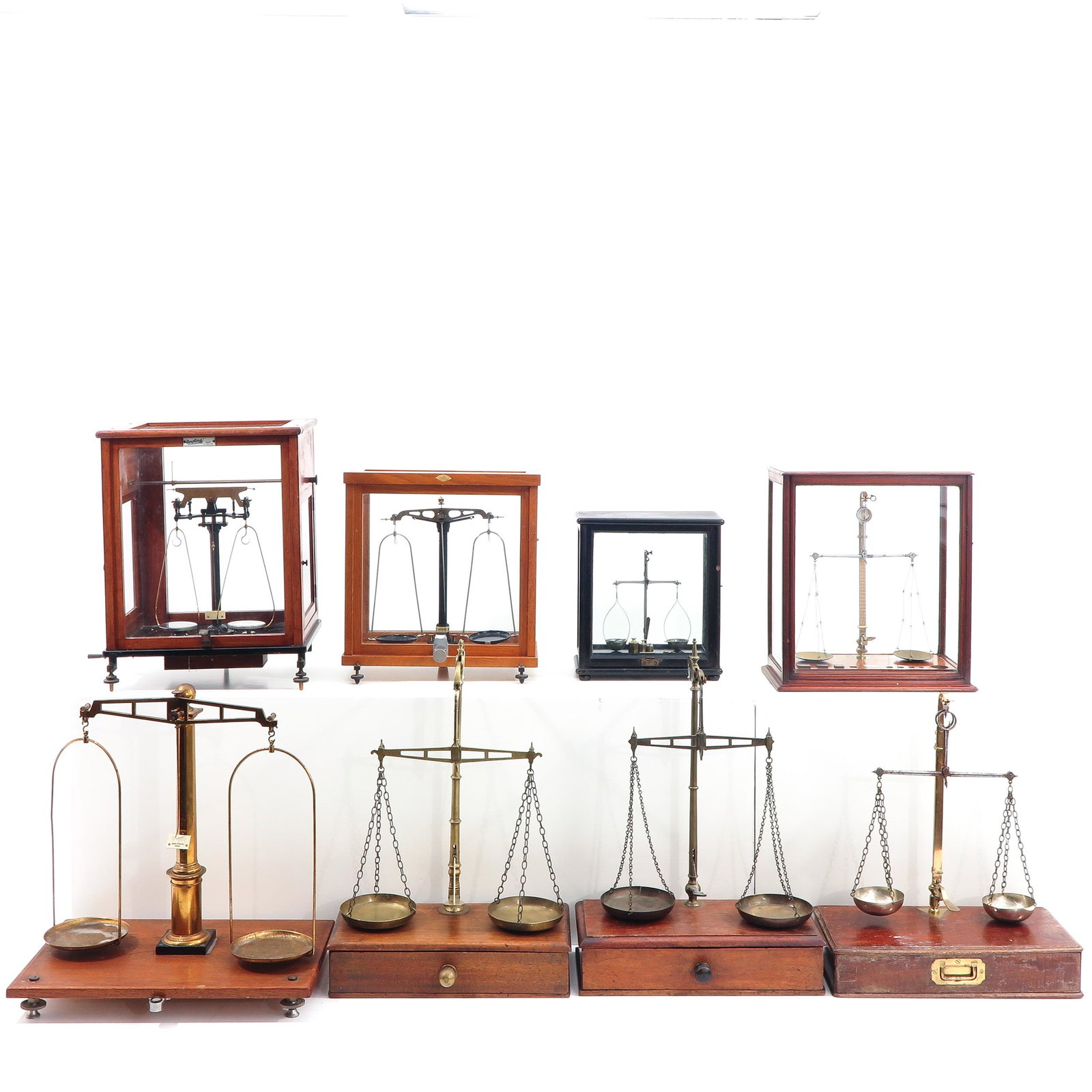 A Collection of 8 Scales: Including Oertling, some in glass vitrines, tallest scale is 58 cm. This lot will not be shipped.