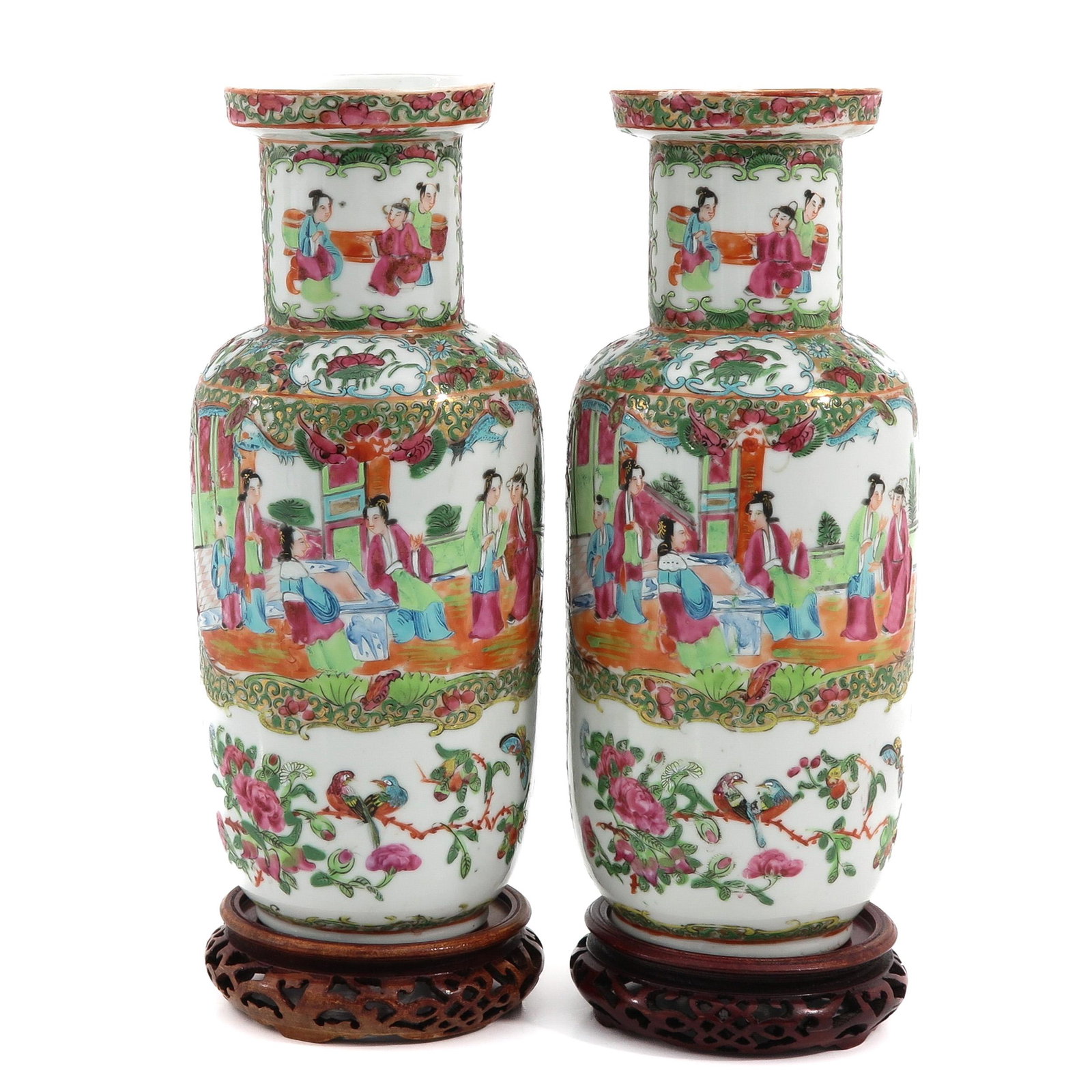 A Pair of Cantonese Vases: Depicting Chinese figures in garden with butterflies and flowers, vases are 31 cm. tall without carved wood base.