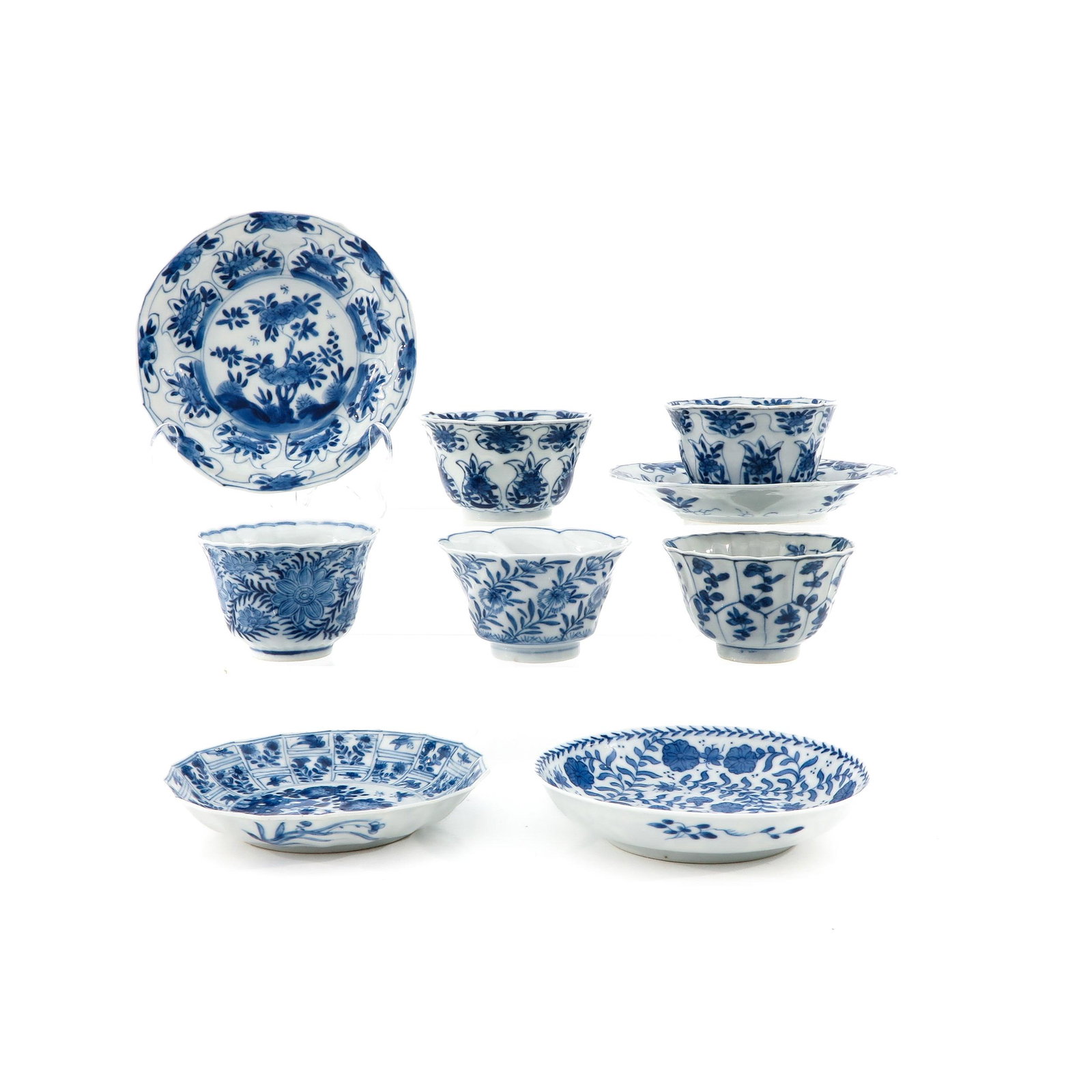 A Collection of Cups and Saucers: Floral decor, saucers are 13 cm. in diameter.