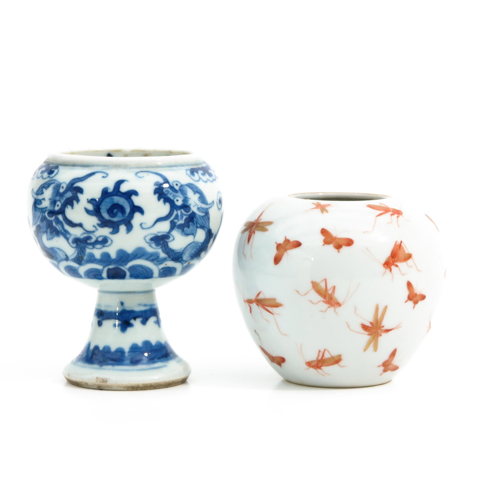 A Stem Cup and Small Vase: Blue and white stem cup is 11 cm. tall and decorated with dragons, small vase is 9 cm. tall and decorated with butterflies marked Daoguang, chip.