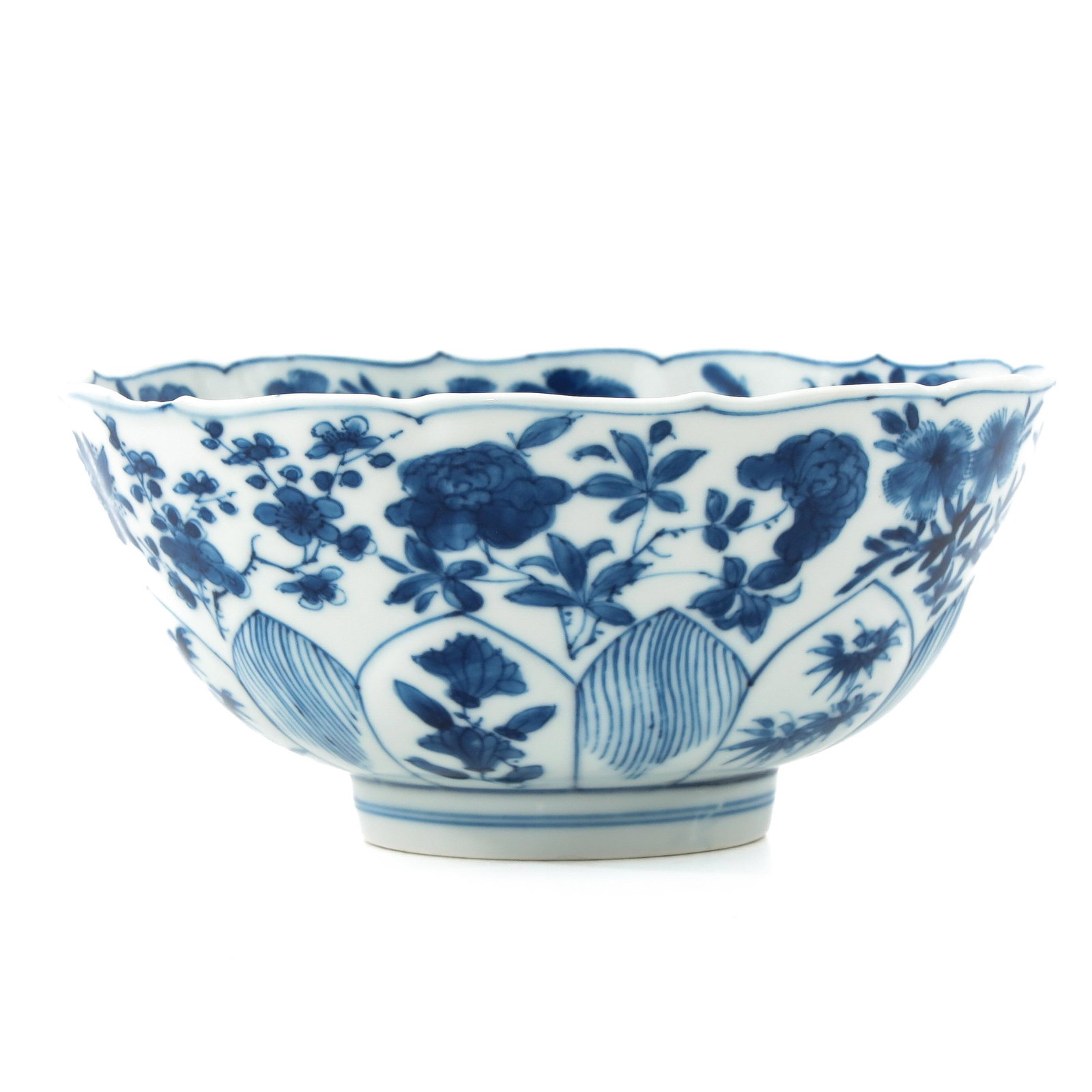 A Blue and White Bowl: Floral decor, Kangxi Mark and Period, 15 cm. in diameter.