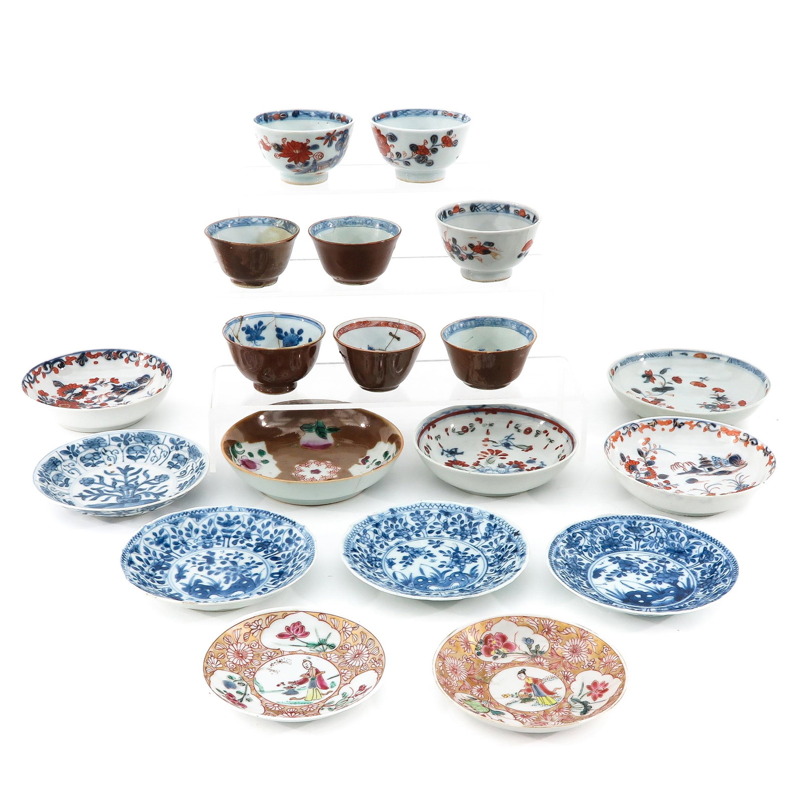 A Collection of Cups and Saucers: In a variety of decors and sizes, some 18th Century, largest saucer is 12 cm. in diameter, in diverse conditions.