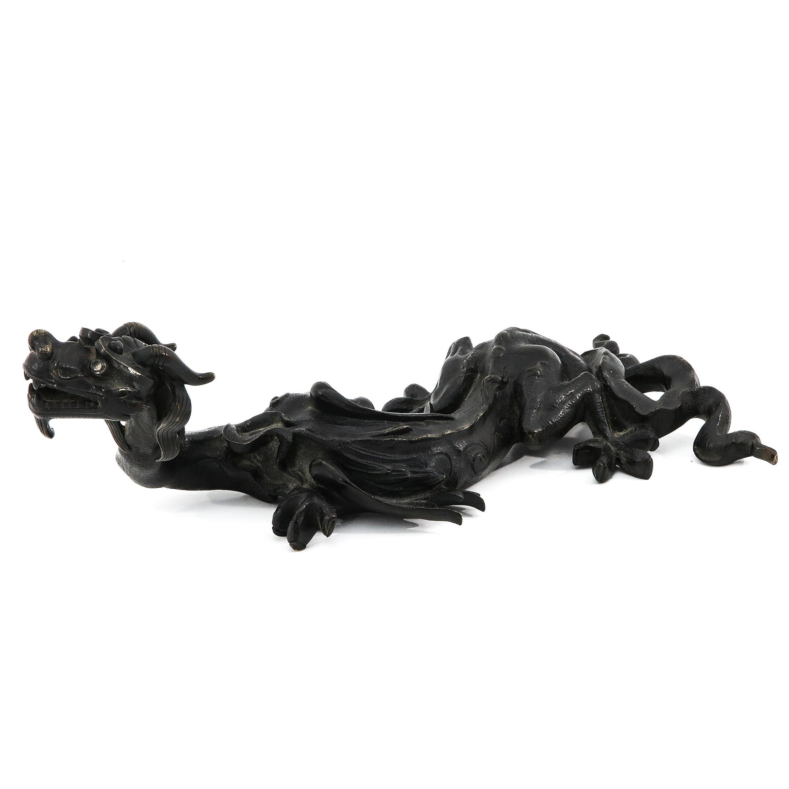 A Bronze Dragon Sculpture: 10 cm. tall x 32 cm. long.
