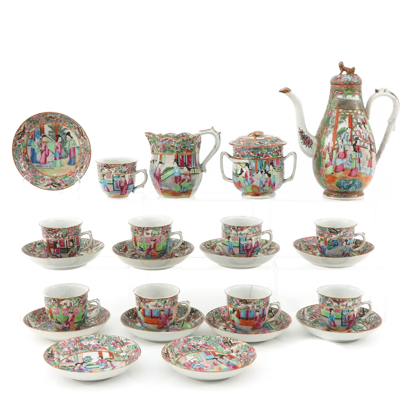 A Cantonese Service: 23 pieces, cups are 8 cm. in diameter, saucers are 14 cm. in diameter, pot is 25 cm. tall, chip and hairline.