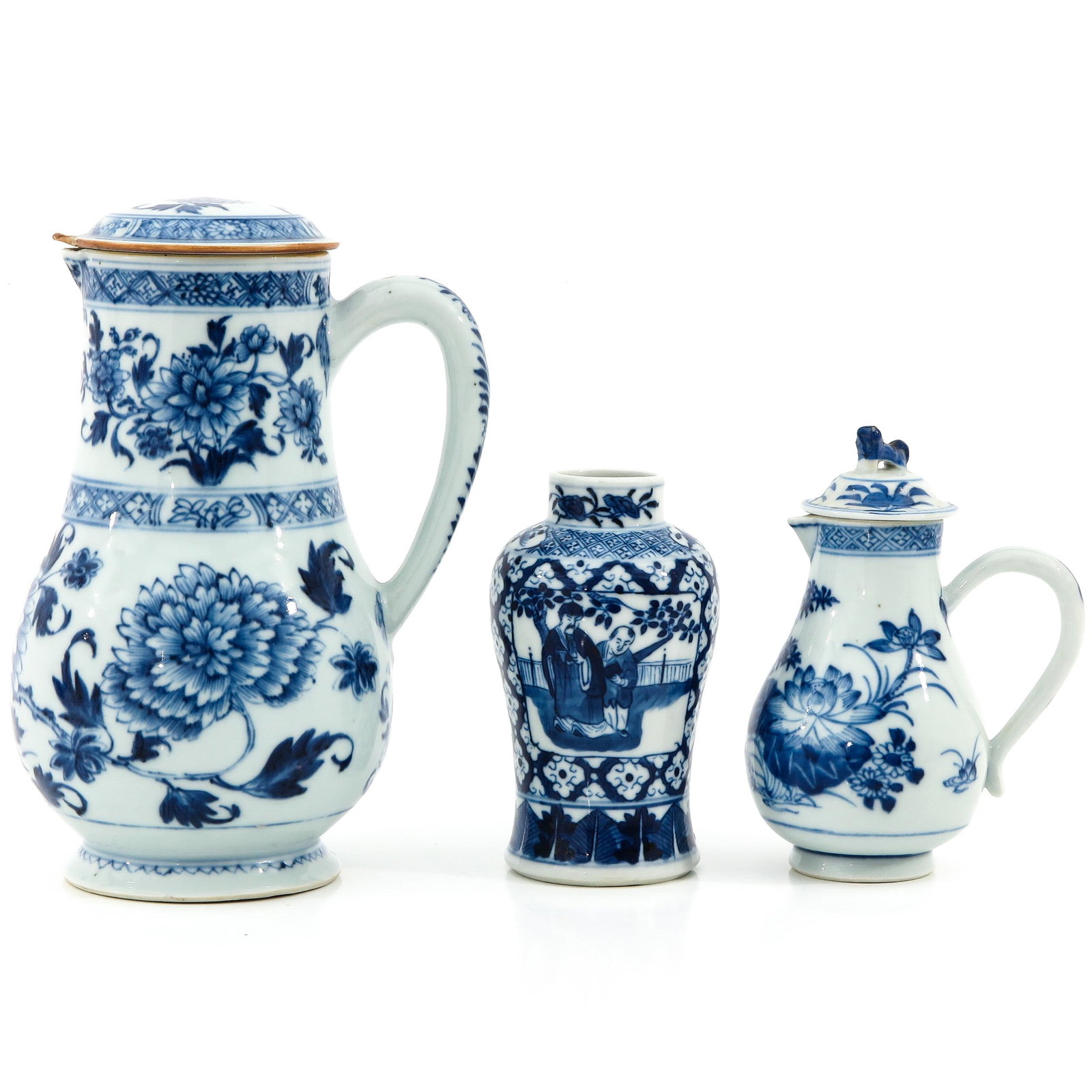 A Collection of Porcelain: Including creamer, vase, and pitcher with cover, in a variety of blue and white decors, including circa 1800, pitcher with cover is 24 cm. tall, in diverse conditions.