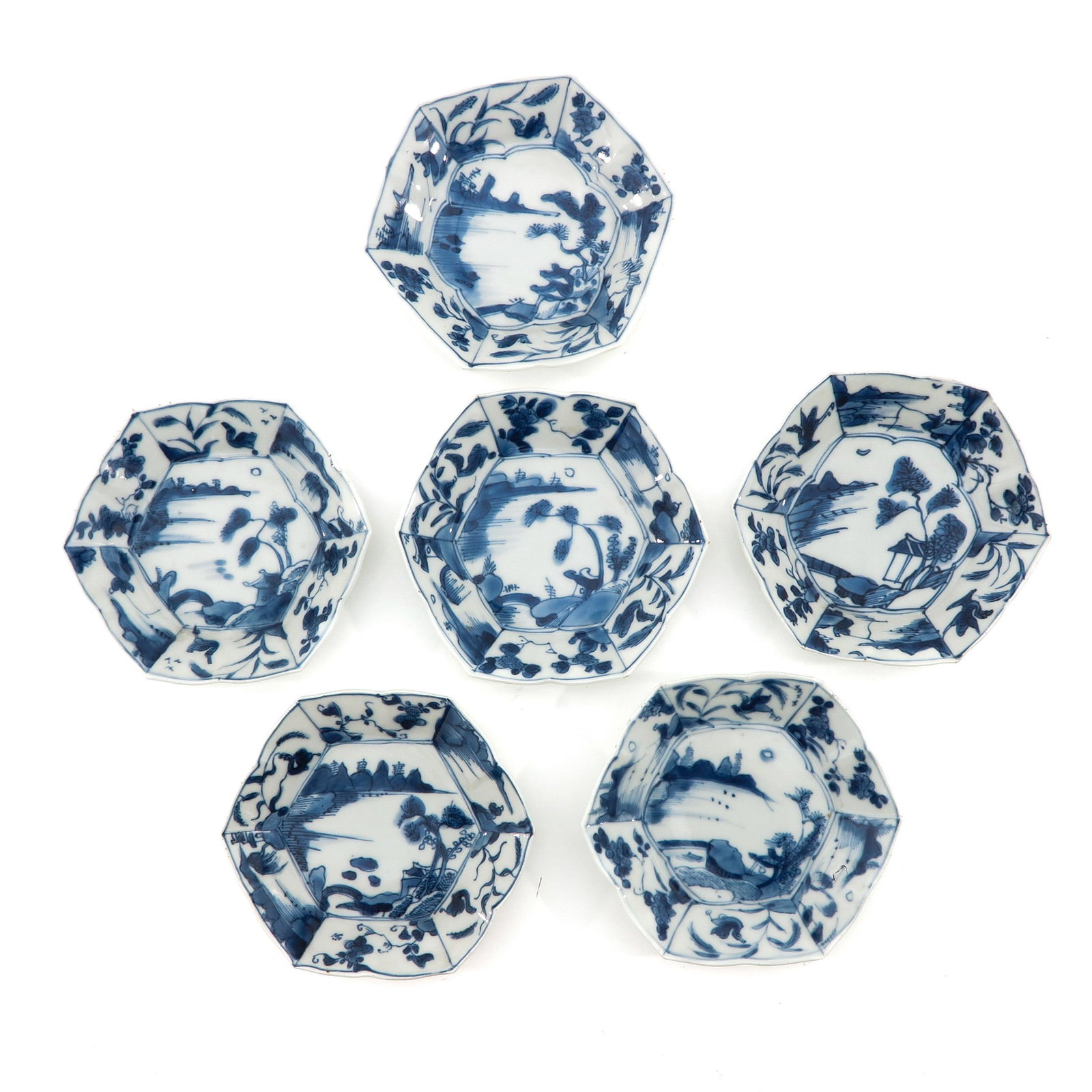 A Series of 6 Blue and White Saucers: Landscape decor, marked with double ring and sacred fungus, saucers are 11 cm. in diameter, chip and hairline.