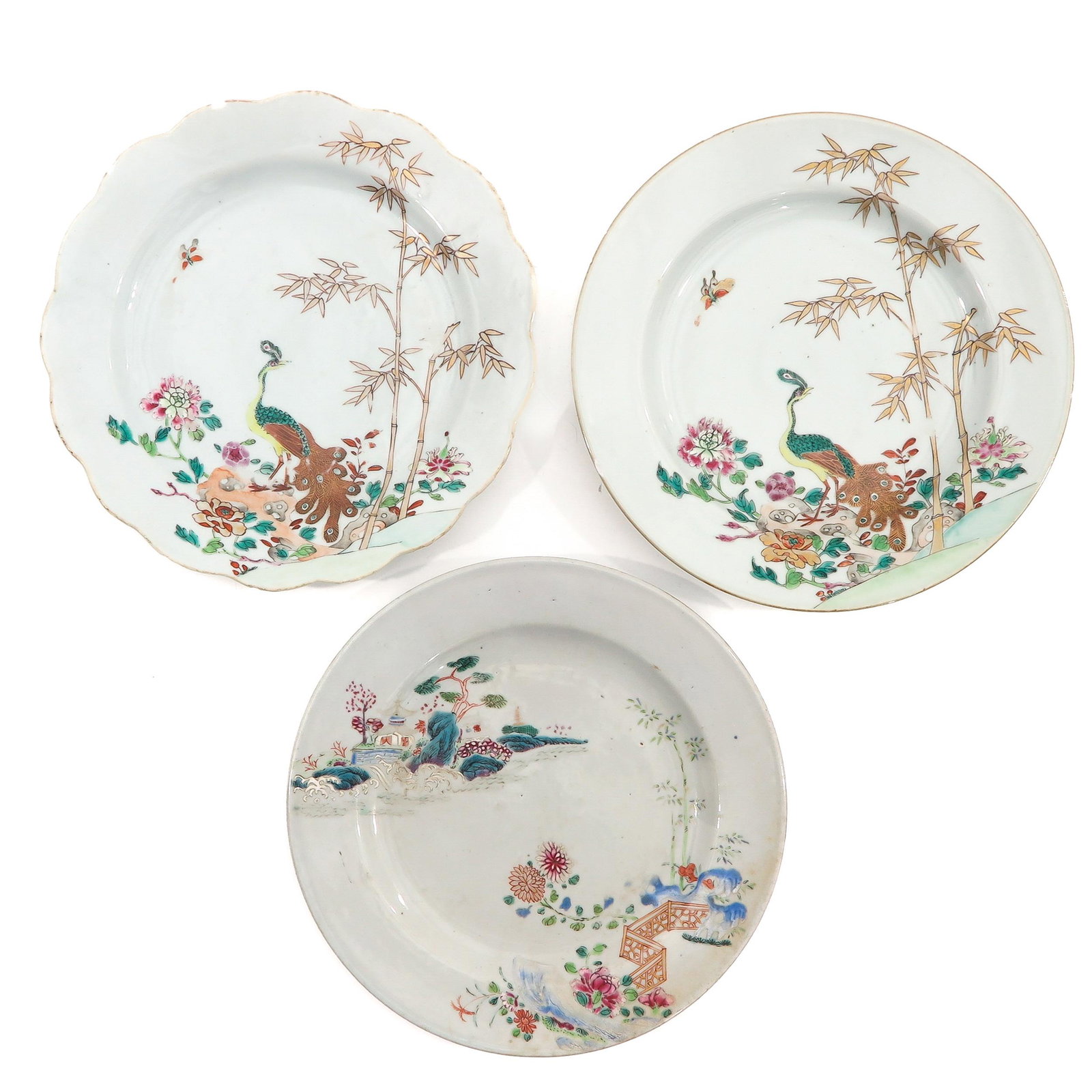 A Collection of 3 Famille Rose Plates: Depicting peacocks and flowers in garden, 23 cm. in diameter, chip.