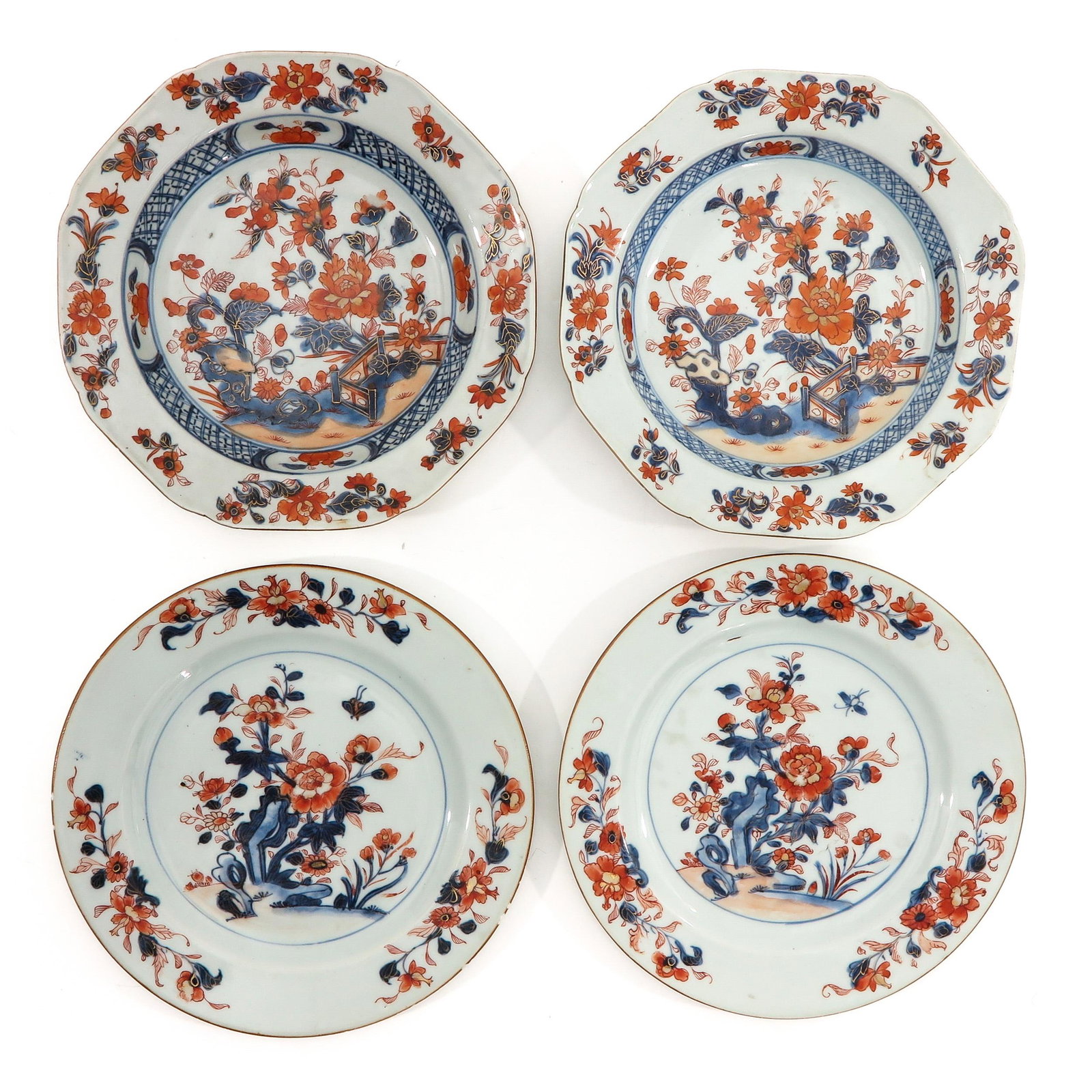 A Collection of 4 Imari Plates: Decorated with flowers in garden, 18th Century, plates measure 22 cm. in diameter, chip and hairine.