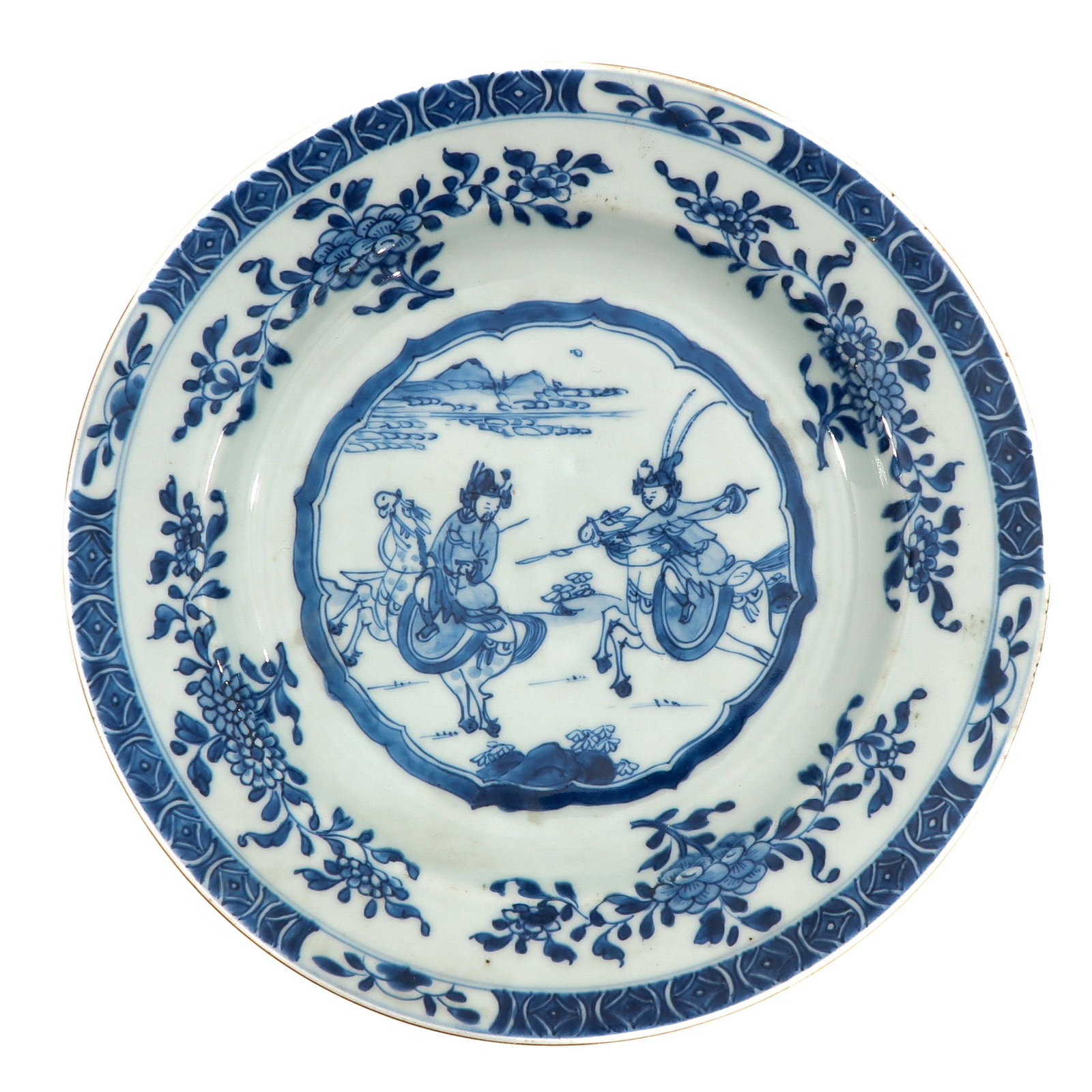 A Blue and White Plate: Decorated with Chinese hunters on horseback, 28 cm. in diameter, 18th Century.