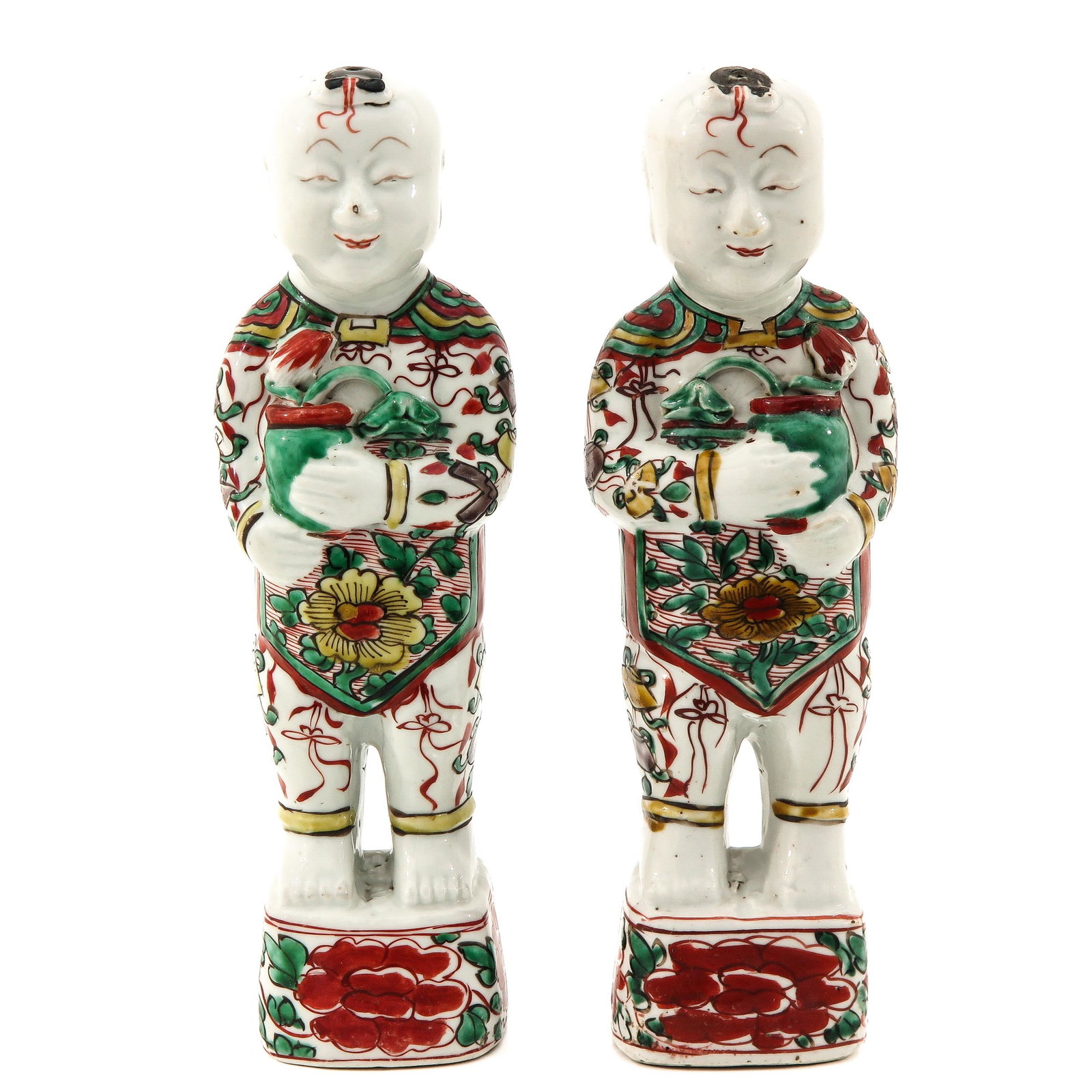 A Pair of Chinese Sculptures: Sunzhi Ming Period, 27 cm. tall, one neck is restored.